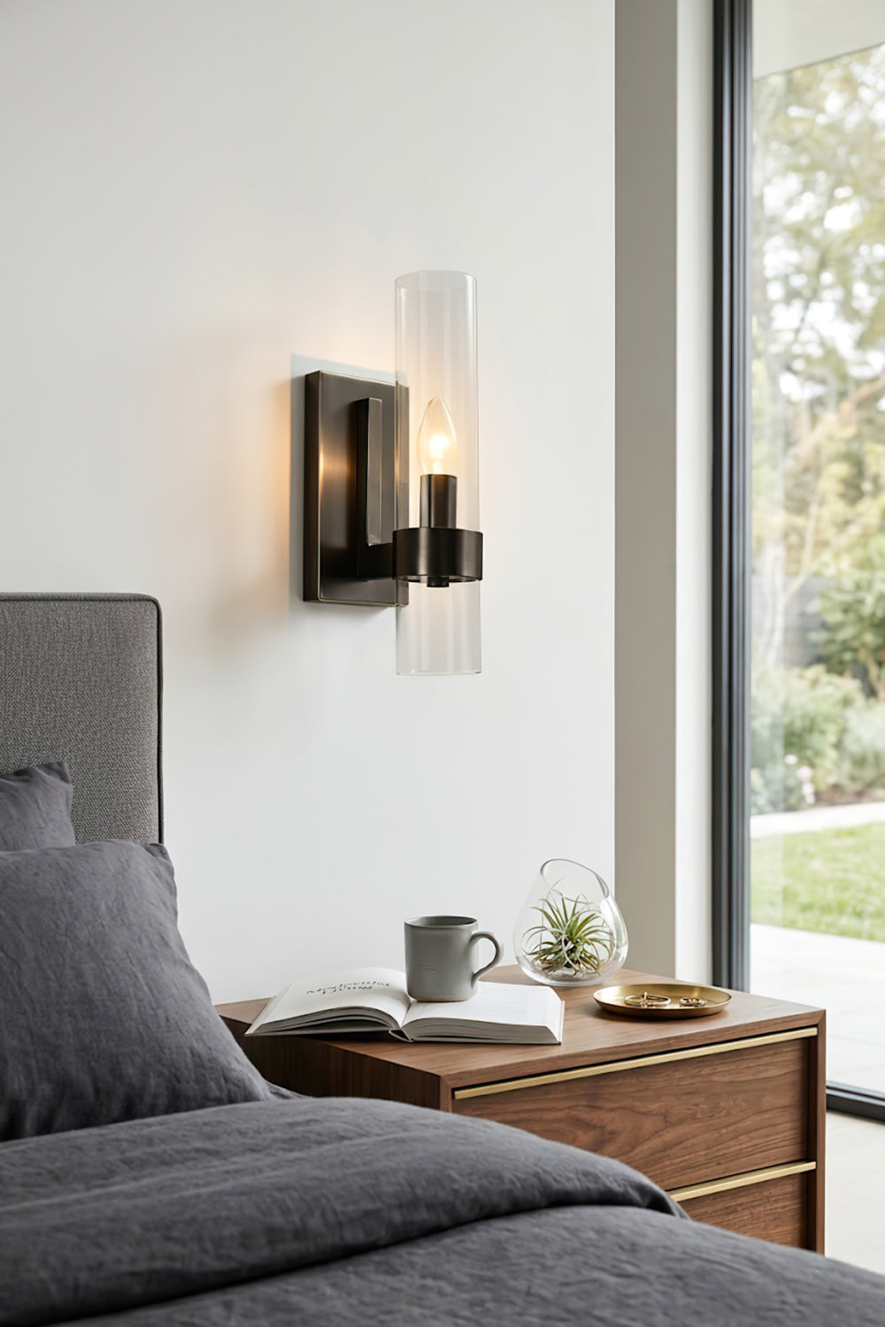 Black linear metallic wall sconce | Brass, Glass | Installed as a bedside reading light | Samu Lamp