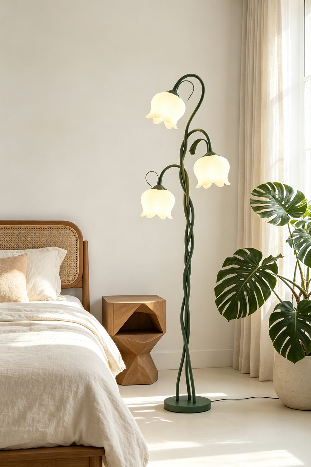 Linnea Tulip Bloom Floor Lamp | Glass and Green Metal | Standing next to a bed and potted plants in a bright bedroom | Samu Lamp