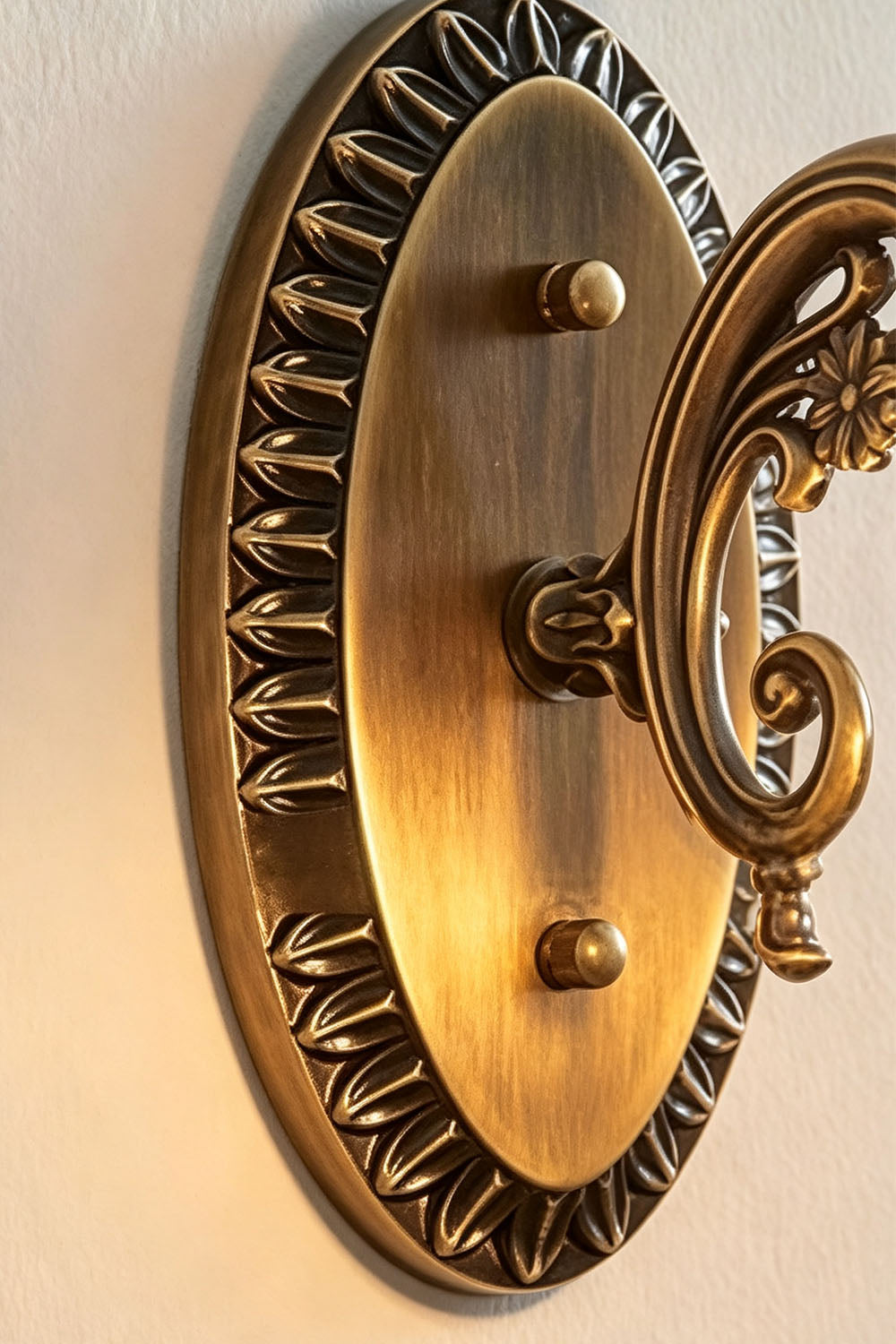 Lisette Blossom Glass Brass Wall Lamp | Glass and Brass | Detail shot showing the oval carved antique brass mounting backplate | Samu Lamp