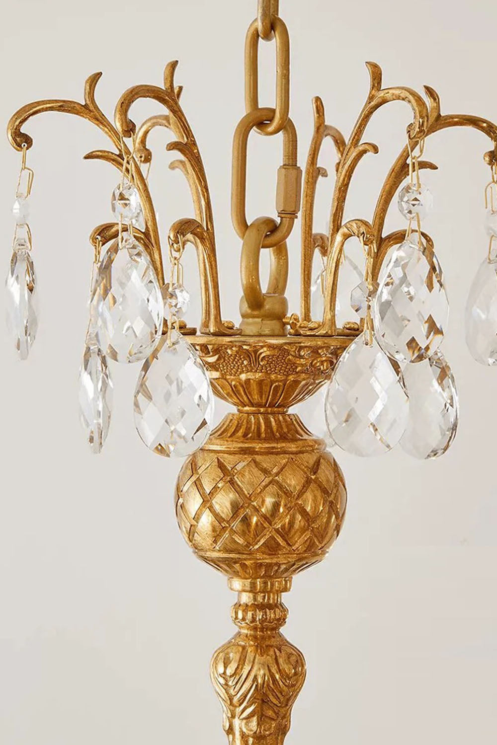 Lisonne Brass Crystal Fringe Linear Chandelier | Cut Crystal and Brass | Close-up detail of the carved brass center spindle and crystal arms | Samu Lamp