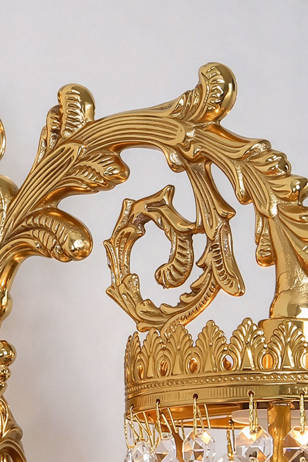 Lisonne Brass Crystal Fringe Linear Chandelier | Cut Crystal and Brass | Macro detail shot of the rococo carved brass scroll arm ornament | Samu Lamp