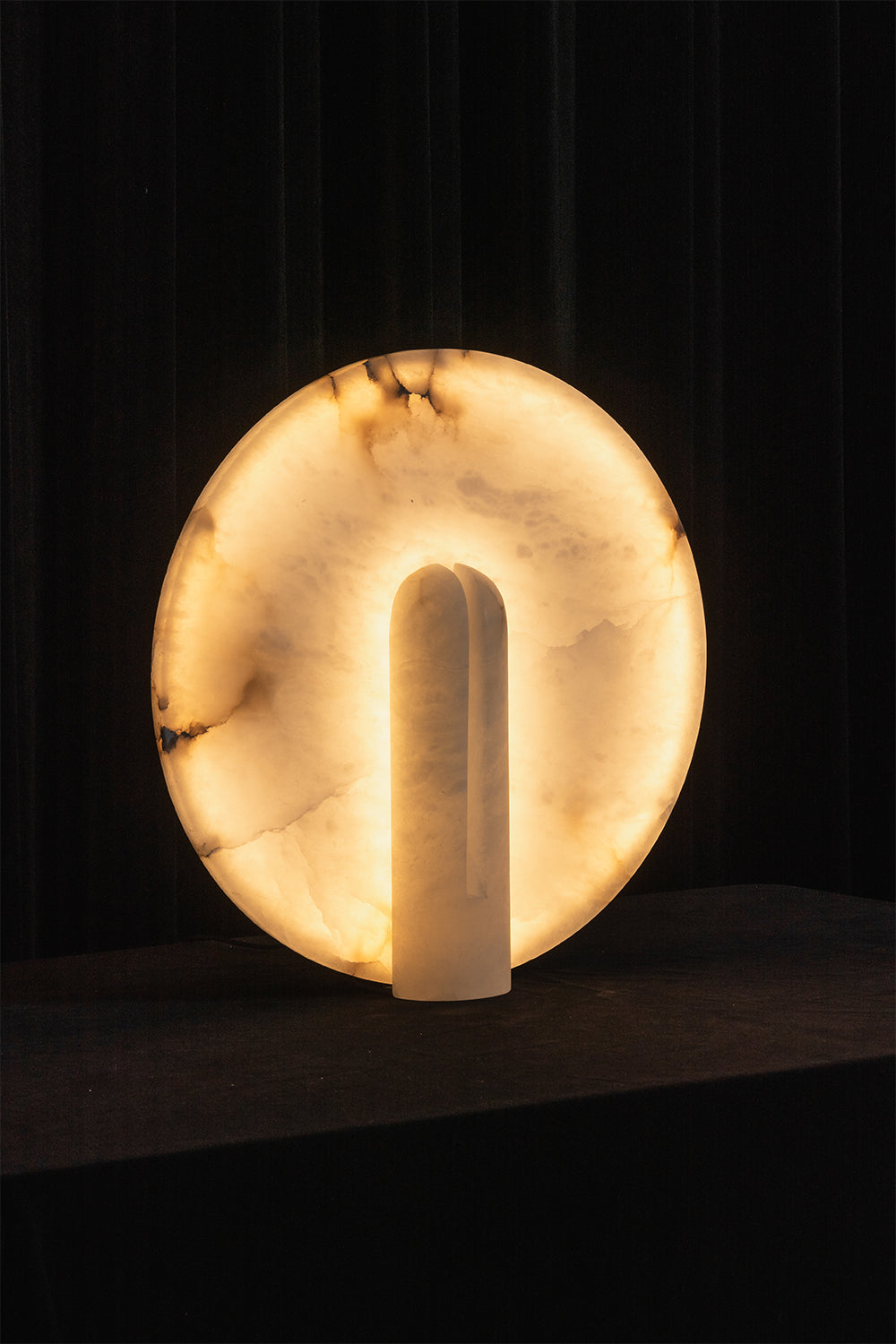 Lunar Horizon Alabaster Table Lamp | Alabaster | Lit product shot against dark background | Samu Lamp