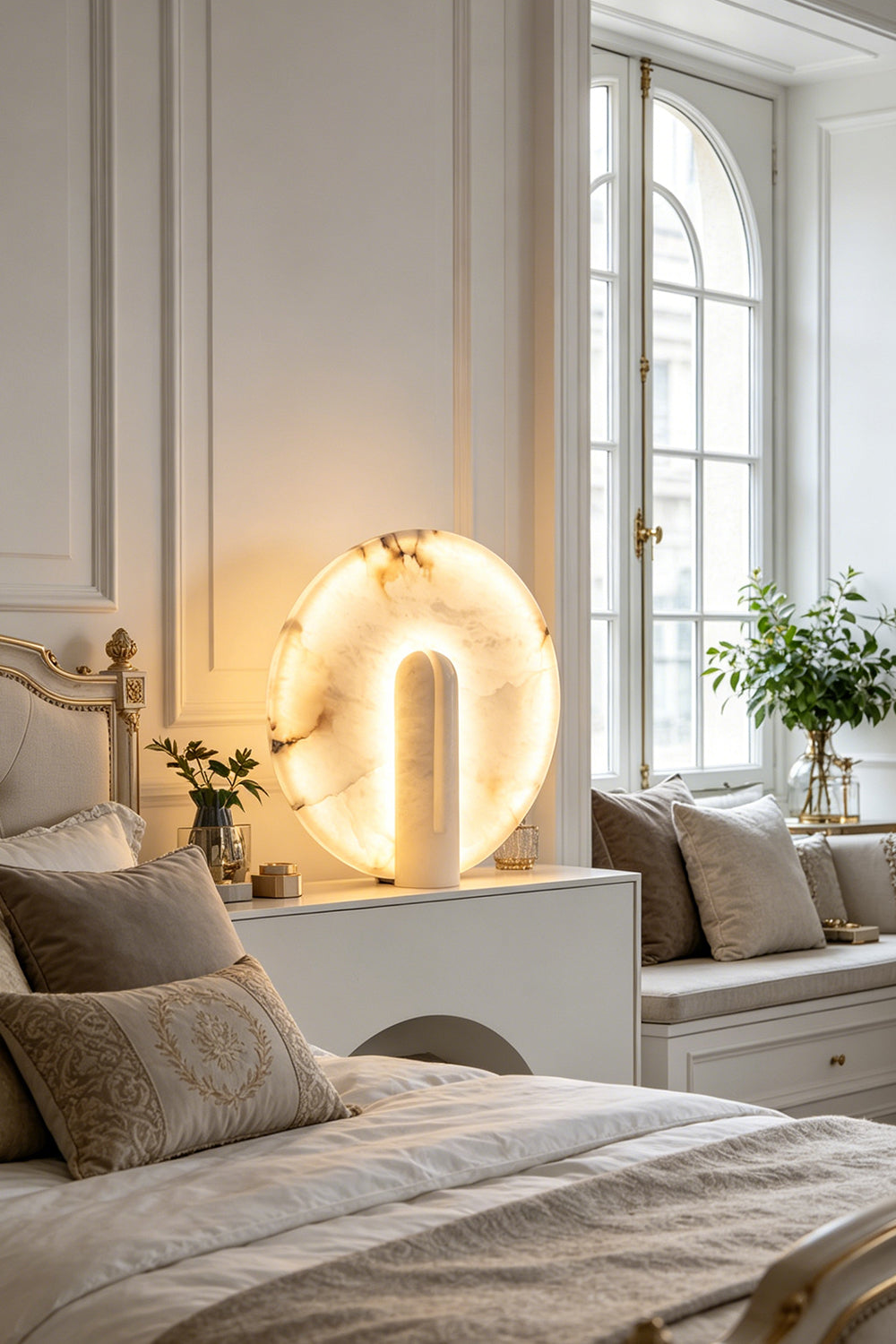 Lunar Horizon Alabaster Table Lamp | Alabaster | Lit on bedside table in bright modern bedroom | Samu Lamp