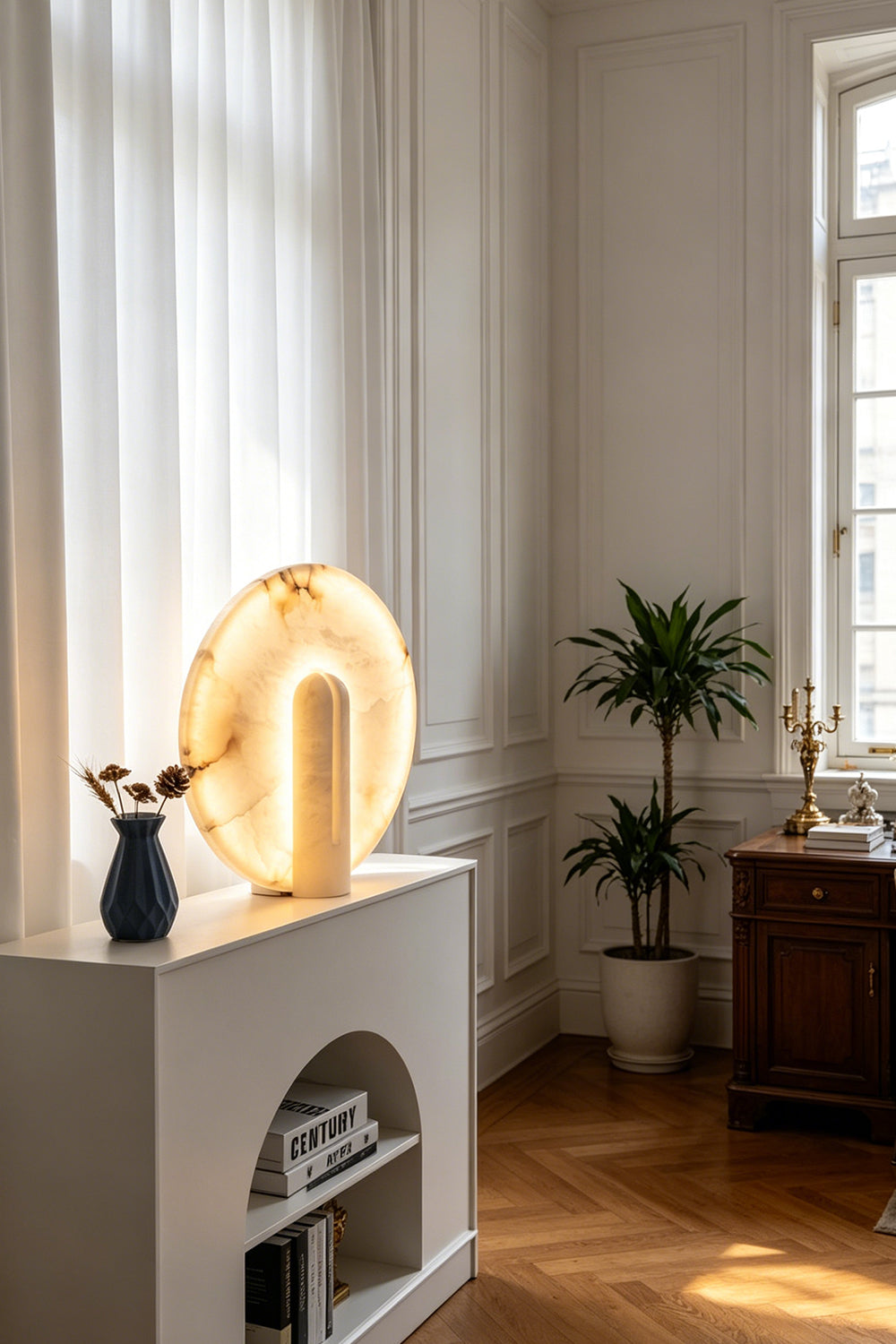 Lunar Horizon Alabaster Table Lamp | Alabaster | Displayed on white mantel in sunlit living room | Samu Lamp