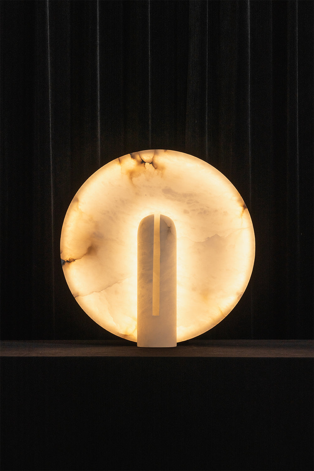 Lunar Horizon Alabaster Table Lamp | Alabaster | Lit product shot against dark background | Samu Lamp