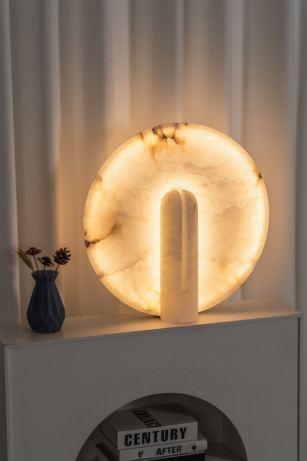 Lunar Horizon Alabaster Table Lamp | Alabaster | Lit view on white shelf in modern interior | Samu Lamp