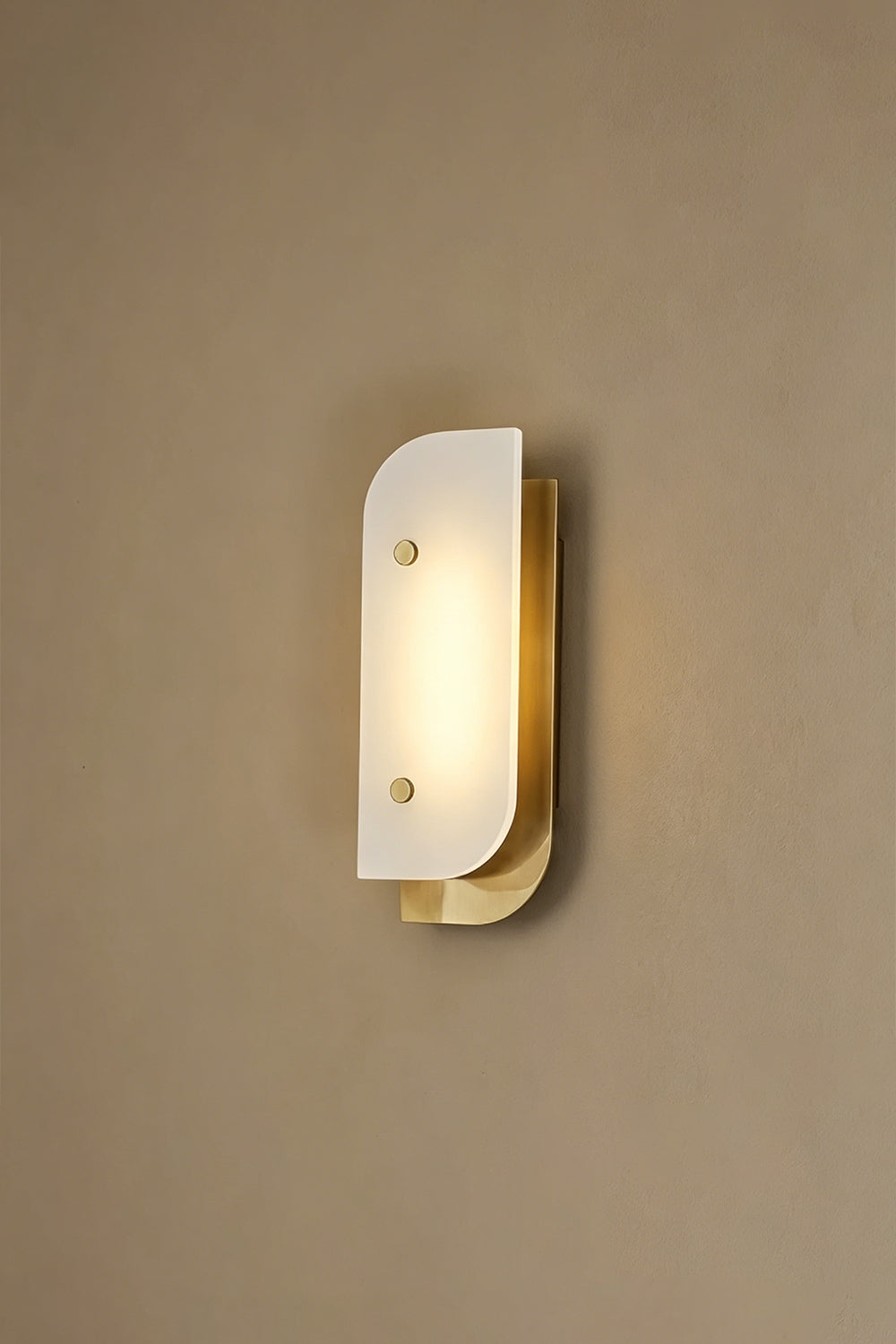 Lit alabaster wall sconce | Alabaster, Metal | Illuminated view against plain wall | Samu Lamp