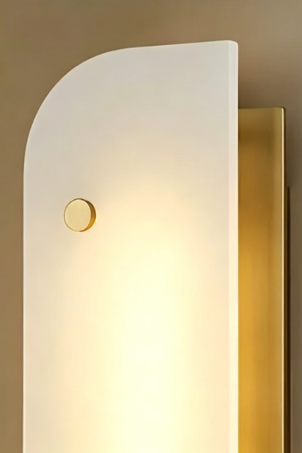 Illuminated alabaster wall light | Alabaster, Metal | Lit product shot against textured wall | Samu Lamp