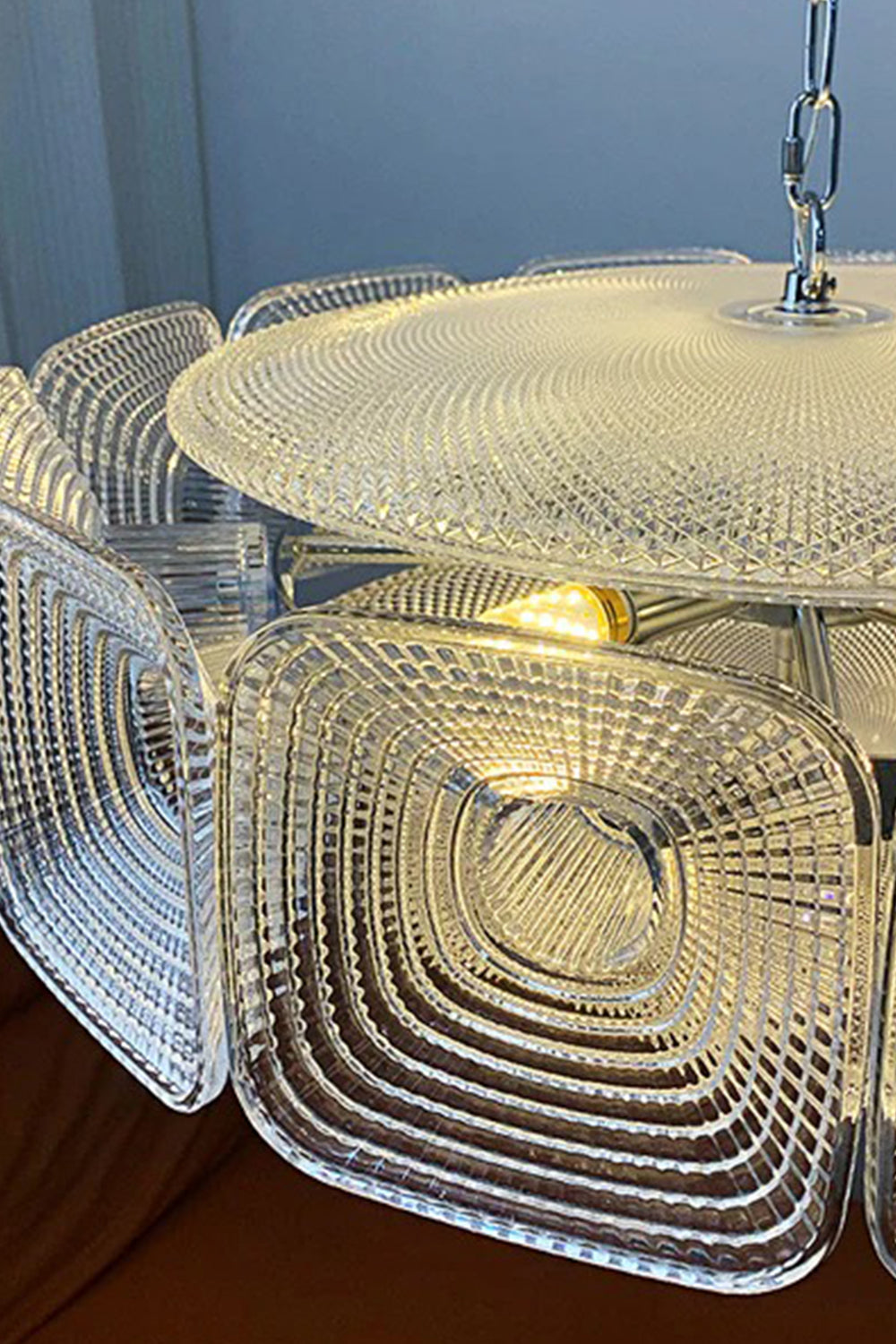Lyra Geometric Glass Chandelier | Glass, Metal | Close-up focus on the clear textured glass block showcasing the detailed concentric square ripple design | Detail shot | Samu Lamp