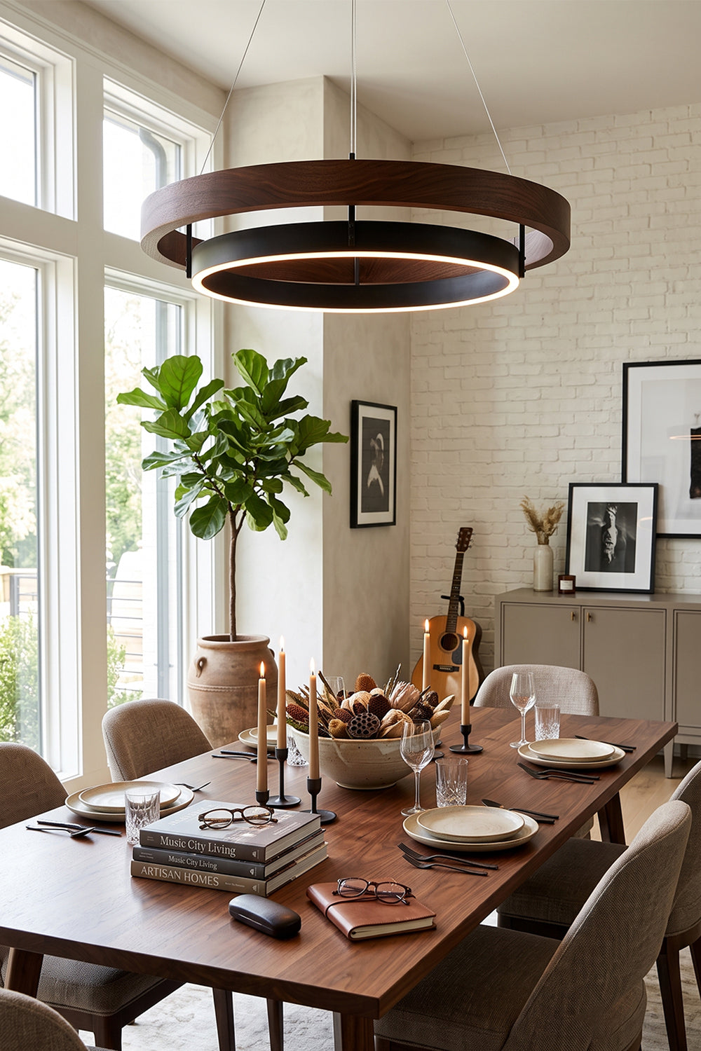 Lysander Dual-Ring LED Chandelier hanging above a dining table in a modern interior setting with warm decor.