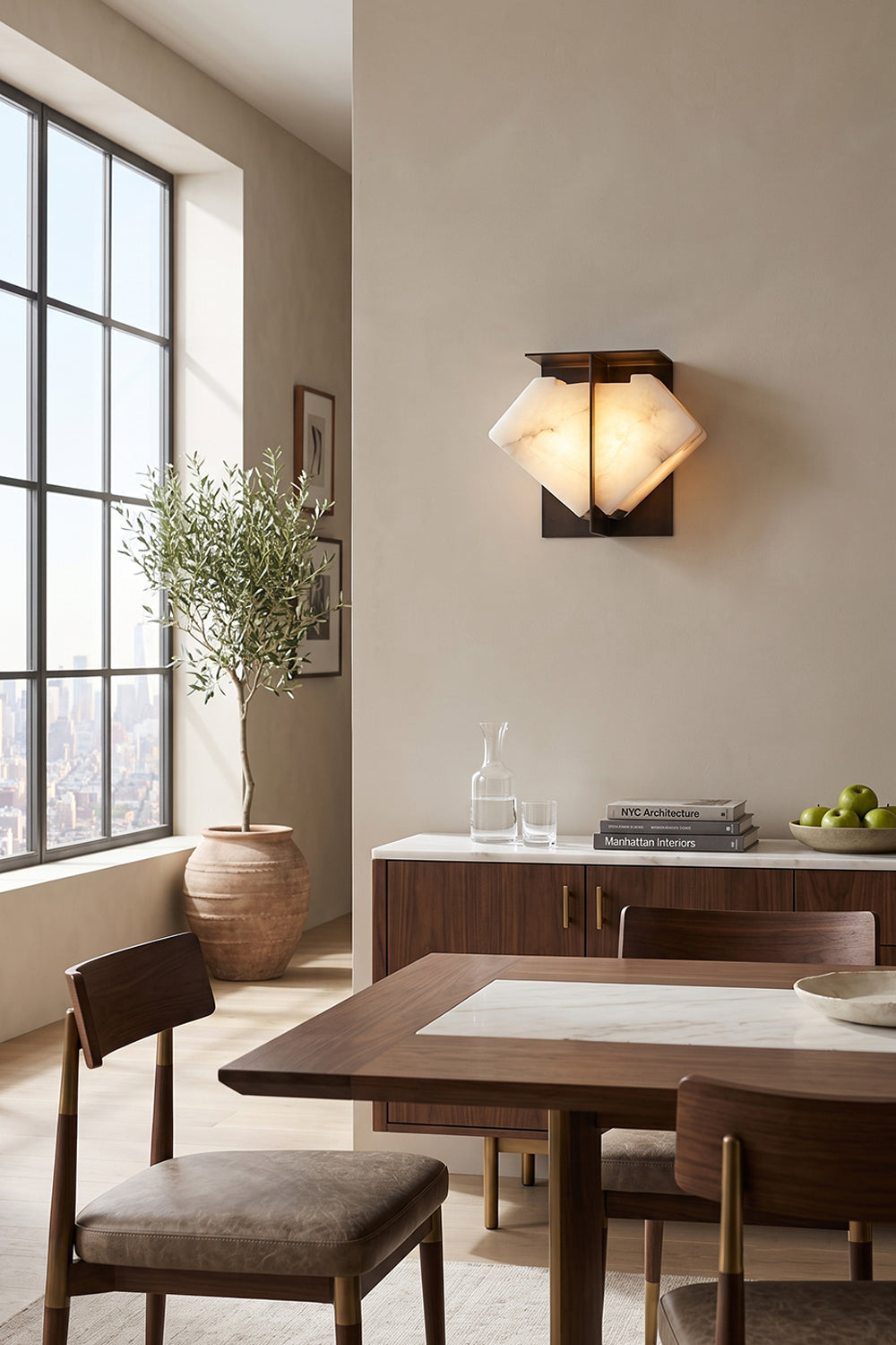 Lysandra Alabaster Folded Halo Wall Lamp | Dining Room Lighting | Positioned elegantly on a wall to illuminate a contemporary dining area with a wooden table, chairs, and large window | Samu Lamp