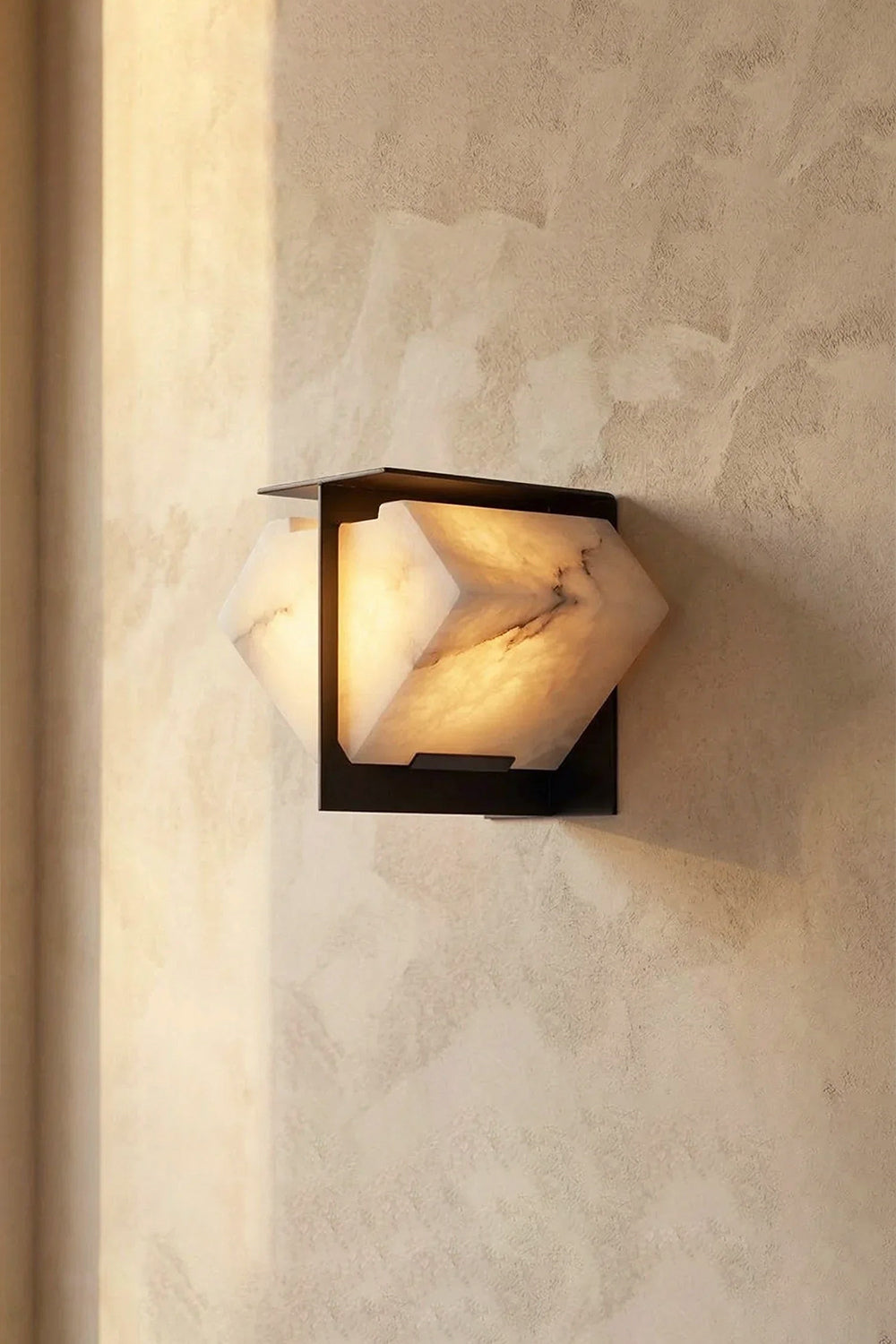 Lysandra Alabaster Folded Halo Wall Lamp | Structural Detail View | Close-up side profile view showing the folded alabaster wings mounted onto the dark bronze backing bracket | Detail shot | Samu Lamp