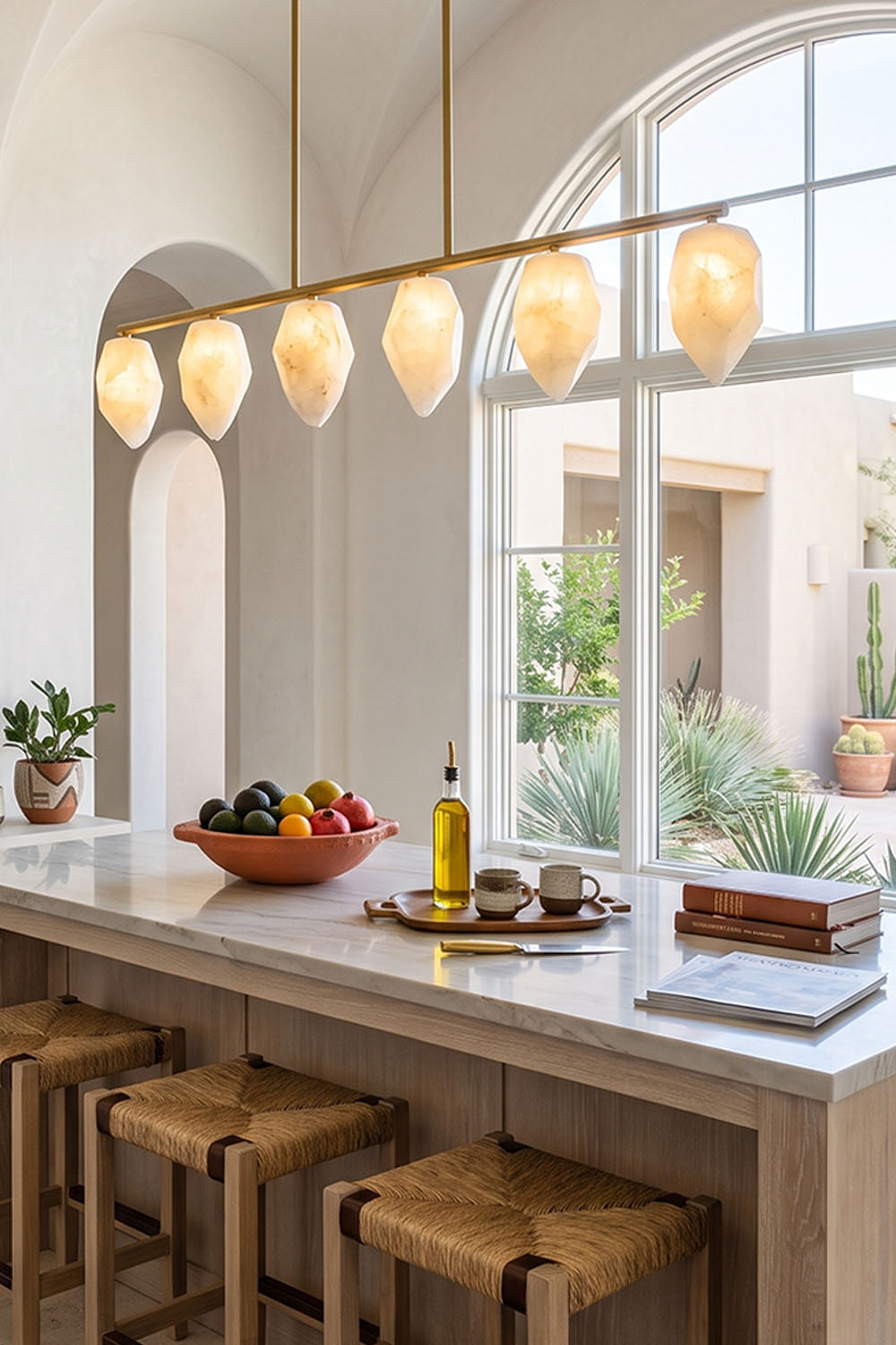 Manon Alabaster Drop Linear Chandelier | Natural Alabaster and Brass | Suspended over a modern kitchen island with wooden bar stools | Samu Lamp