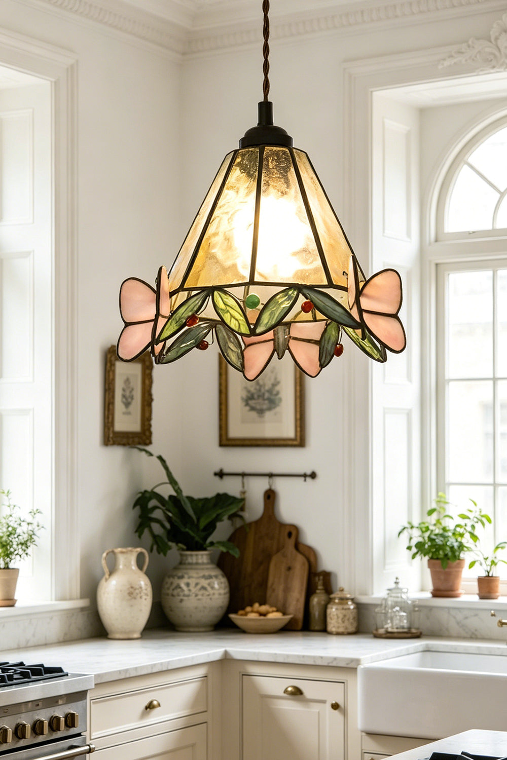 Mariposa Canopy Stained Glass Pendant Lamp | Glass, Metal | Providing a warm glow over a kitchen counter in a rustic farmhouse kitchen with an arched window | Samu Lamp
