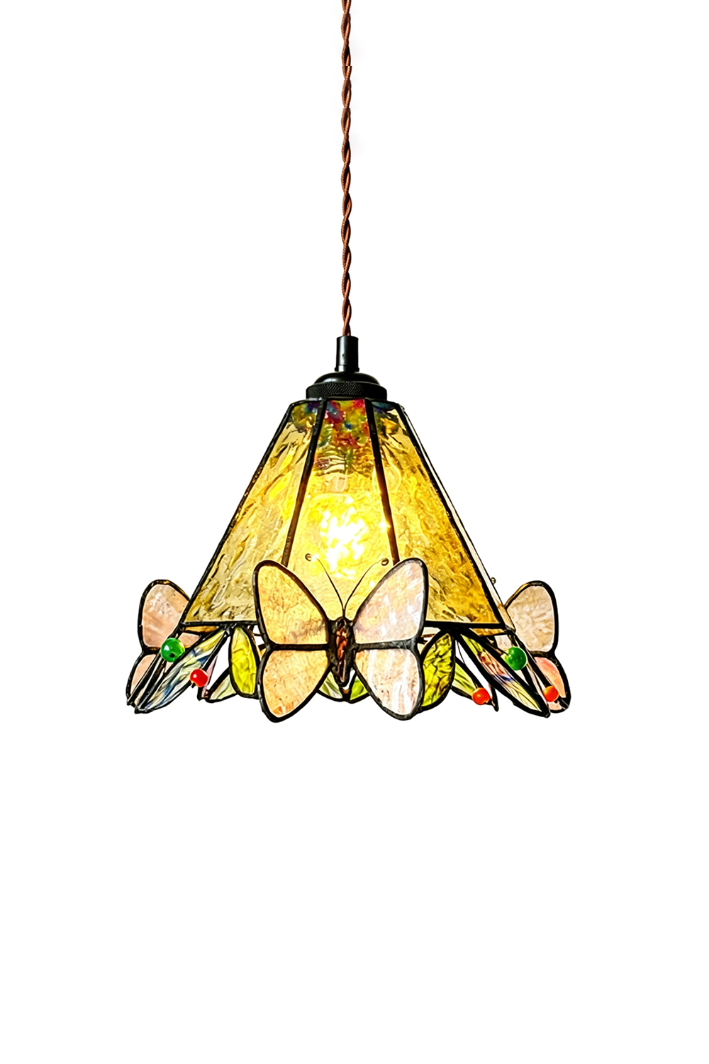 Mariposa Canopy Stained Glass Pendant Lamp | Glass, Metal | Fully lit Tiffany-style conical stained glass pendant light with yellow textured panels and pink butterfly accents hanging from a twisted brown cord | Isolated lit product shot on white background | Samu Lamp