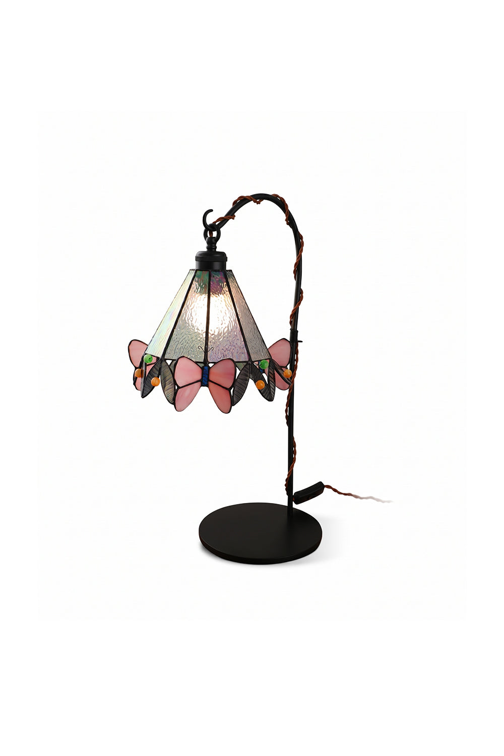 Mariposa Stained Glass Table Lamp | Glass, Metal | Elegant Tiffany-style stained glass desk lamp with pink butterfly motifs along the scalloped rim, hanging from a curved black metal arm | Isolated product shot on white background | Samu Lamp