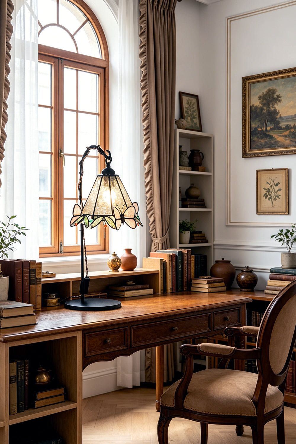 Mariposa Stained Glass Table Lamp | Glass, Metal | Enhancing a spacious home office setup on a long wooden executive desk under soft window light | Samu Lamp