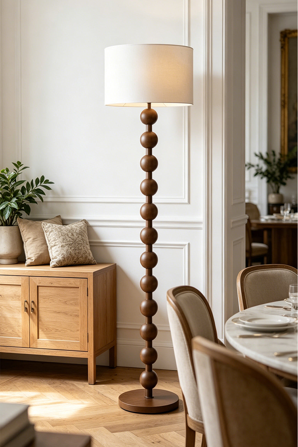 Marlow Stacked Wood Floor Lamp | Wood, Fabric | Providing warm inviting light in a sophisticated dining room corner next to a wooden sideboard and upholstered dining chairs | Samu Lamp