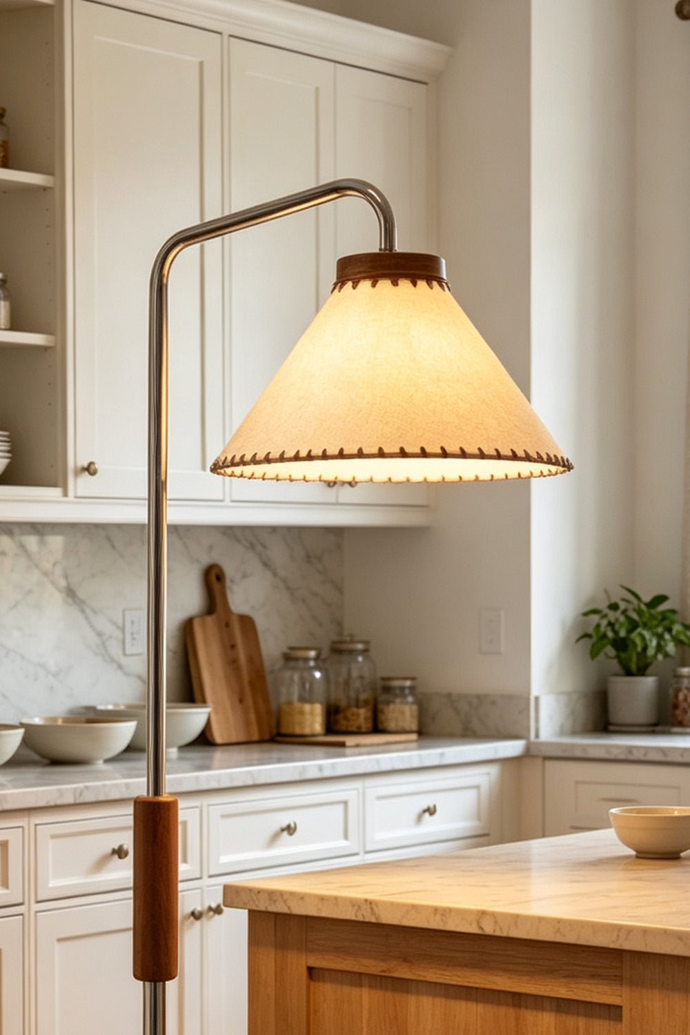 Marlowe Angled Linen Reading Floor Lamp | Linen, Wood, and Chrome Metal | Medium shot focusing on the upper section of the lamp illuminating a bright rustic kitchen corner | Samu Lamp