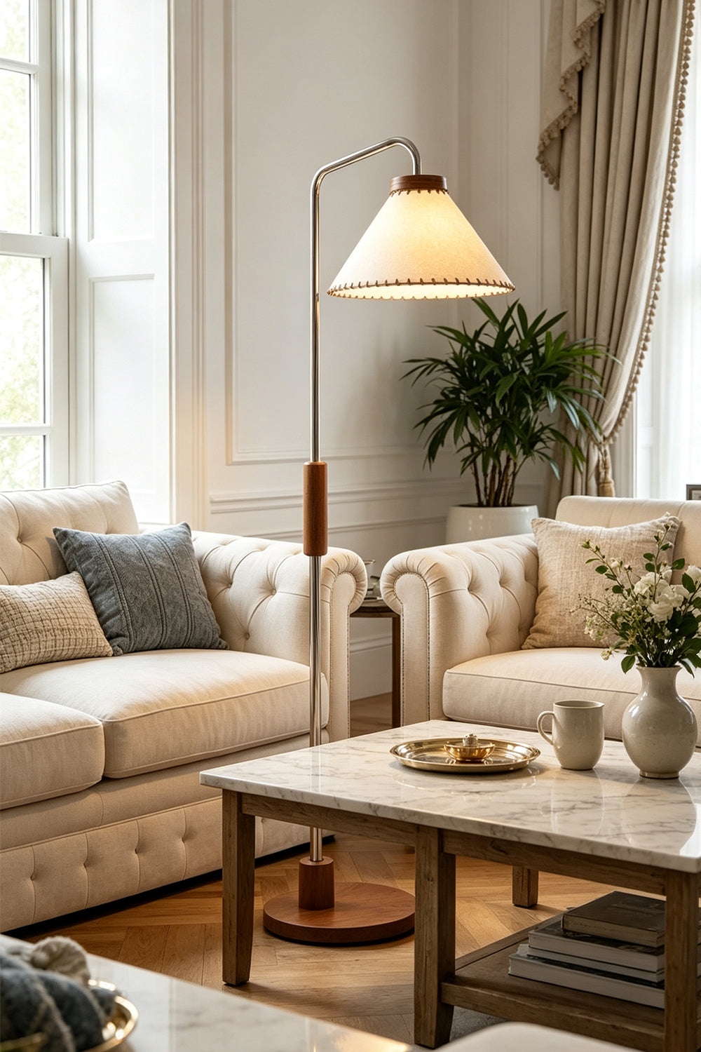 Marlowe Angled Linen Reading Floor Lamp | Linen, Wood, and Chrome Metal | Styled in a brightly lit contemporary living room next to elegant white sofas and a coffee table | Samu Lamp