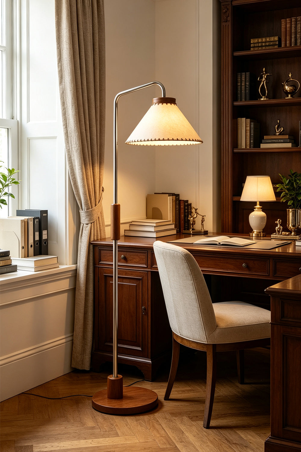 Marlowe Angled Linen Reading Floor Lamp | Linen, Wood, and Chrome Metal | Placed next to a dark wood study desk with a plush white office chair in a traditional home library | Samu Lamp