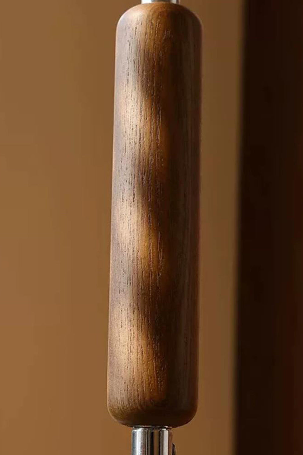 Marlowe Angled Linen Reading Floor Lamp | Linen, Wood, and Chrome Metal | Detailed close-up shot focusing on the rich texture of the fluted wooden accent grip on the metal rod | Samu Lamp