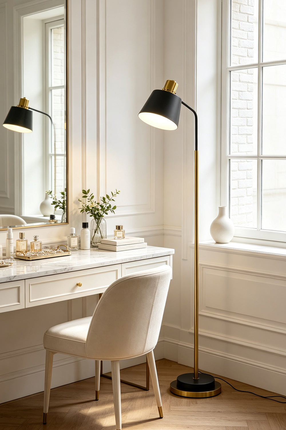 Marlowe Gooseneck Reading Floor Lamp | Matte Black and Brass | Positioned beside an elegant marble vanity table in a bright dressing room | Samu Lamp