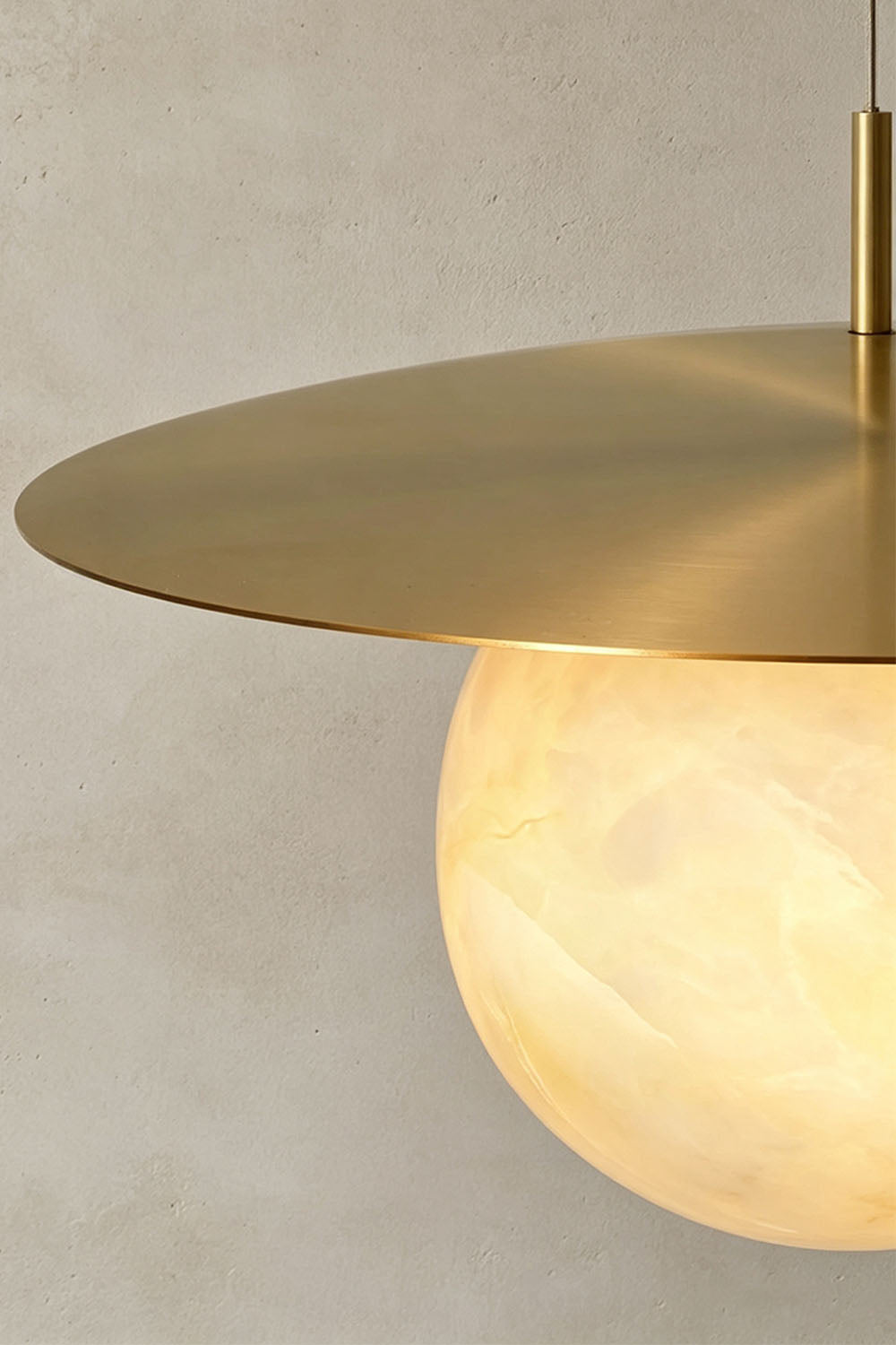Marne Alabaster Sphere Brass Pendant Light | Natural Alabaster and Brass | Macro detail view of the flat brass shade edge and alabaster sphere | Samu Lamp
