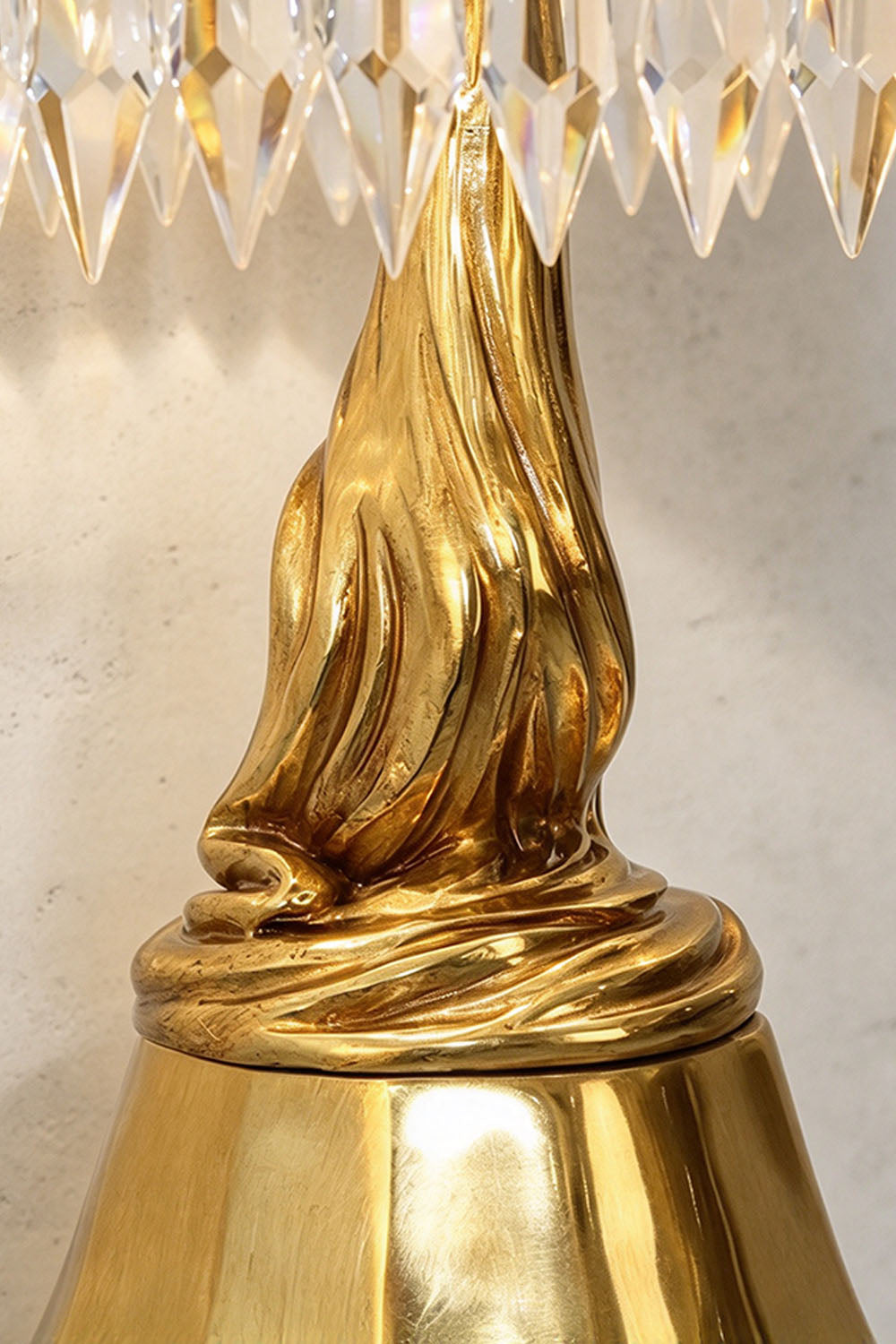 Mervaise Brass Cherub Crystal Tier Table Lamp | Brass and Crystal | Close-up view of the sculpted brass pedestal base and twisted stem | Samu Lamp