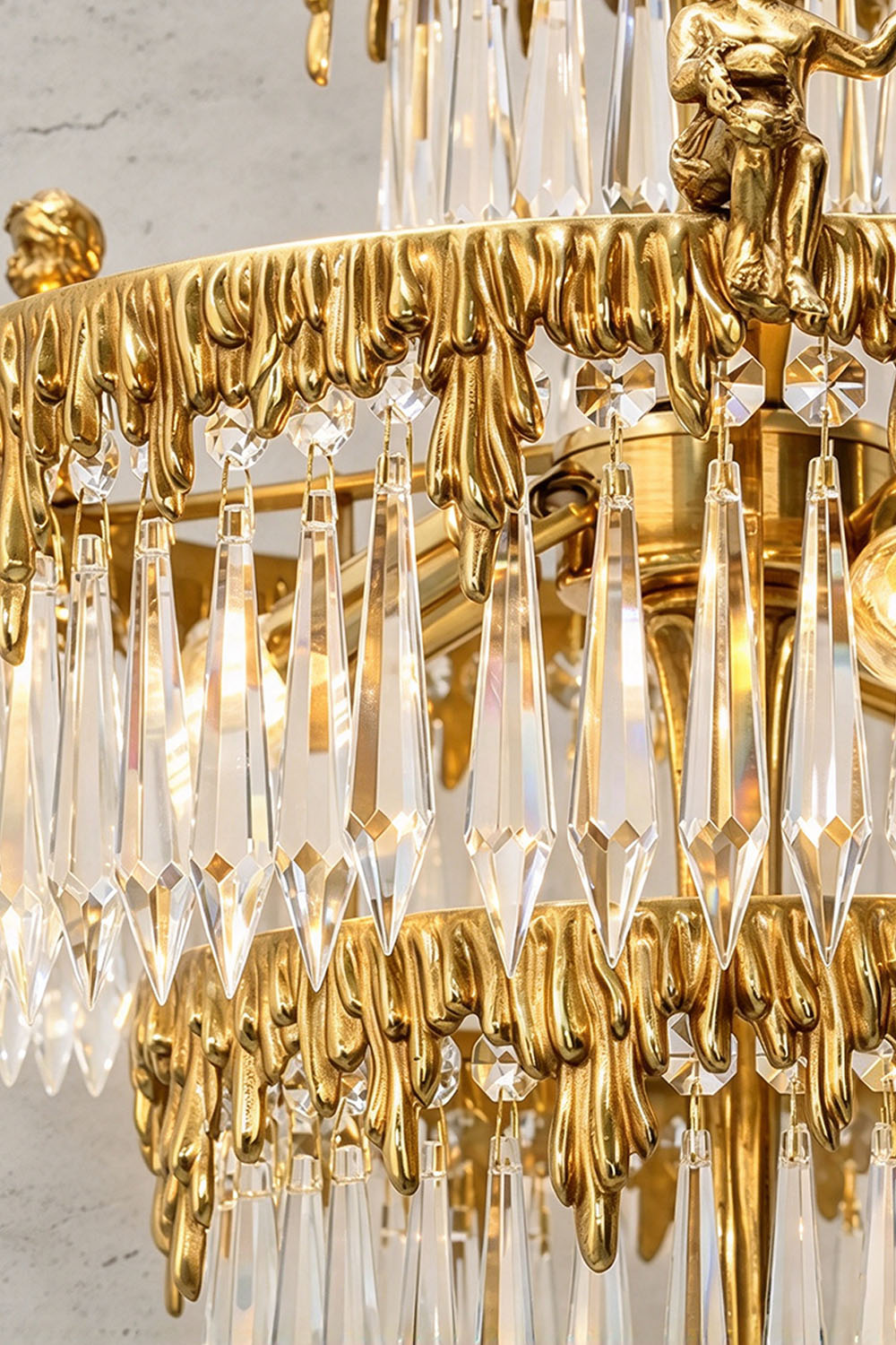 Mervaise Brass Cherub Crystal Tier Table Lamp | Brass and Crystal | Close-up view of cascading crystal prisms hanging on brass tier rings | Samu Lamp