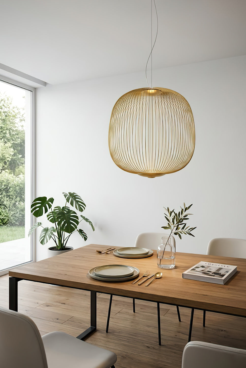 Gold elliptical wire cage light over wooden dining table | Aluminum | Interior dining room scene with natural light | Samu Lamp