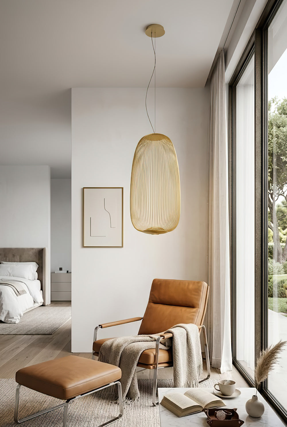 Gold elliptical cage light over leather armchair | Aluminum | Modern bedroom or living room corner | Samu Lamp
