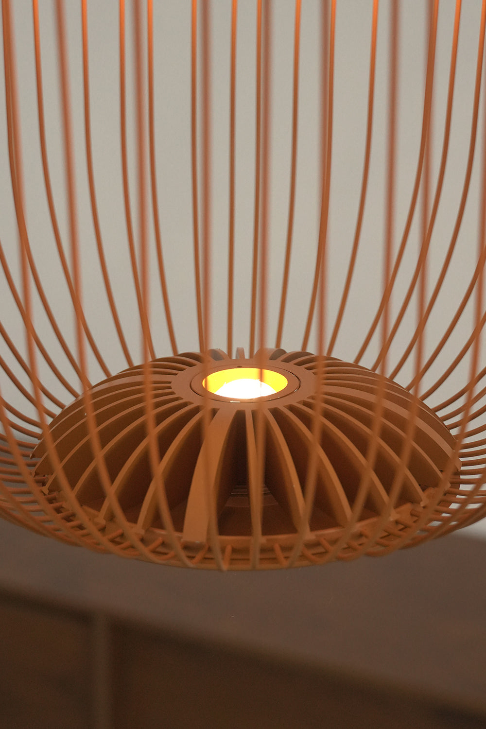 Lit bottom center of wire cage pendant light | Aluminum | Showing internal light source and glowing wires | Samu Lamp
