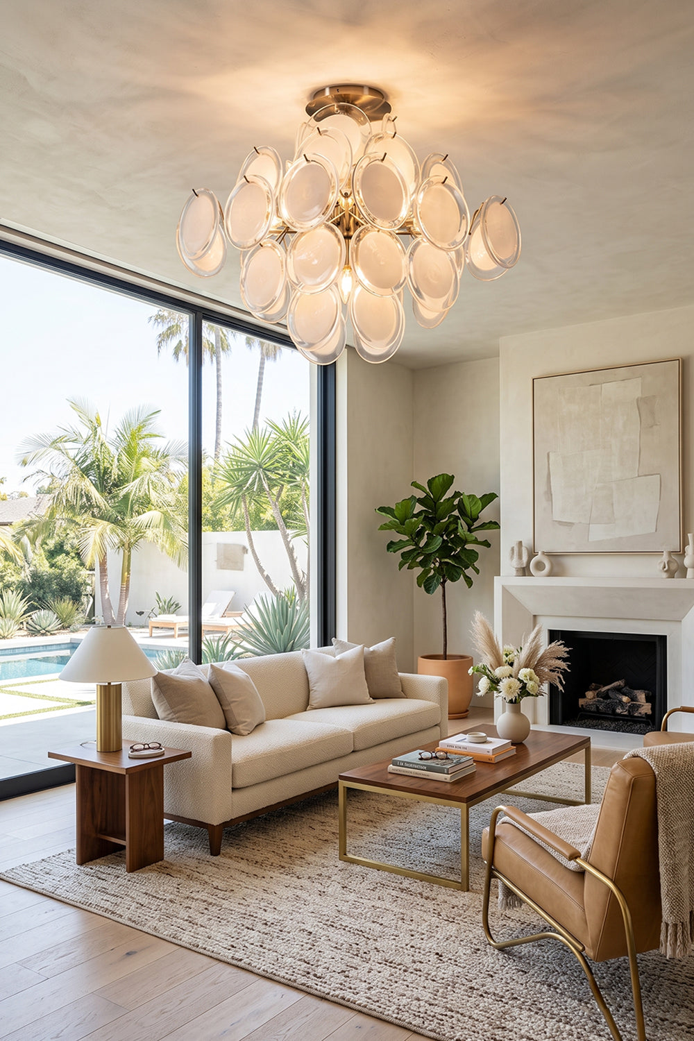 Mirella Circular Glass Pane Ceiling Light | Living Room Ambient Light | Radiating a warm cozy halo above a cream sofa and tan leather armchair in a spacious upscale living room | Samu Lamp