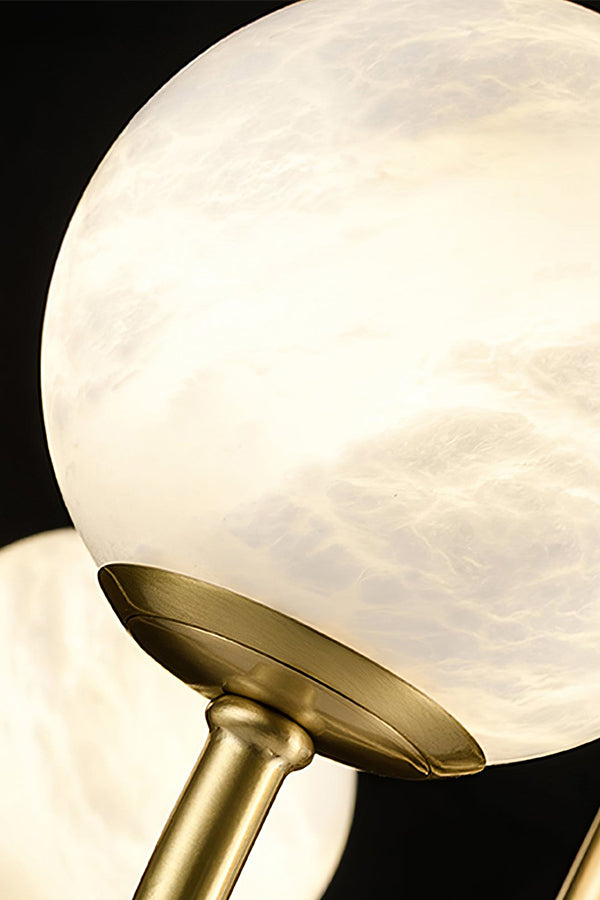 Close-up of natural alabaster globe | Alabaster | Detailed view of stone veining and brass fitting | Samu Lamp