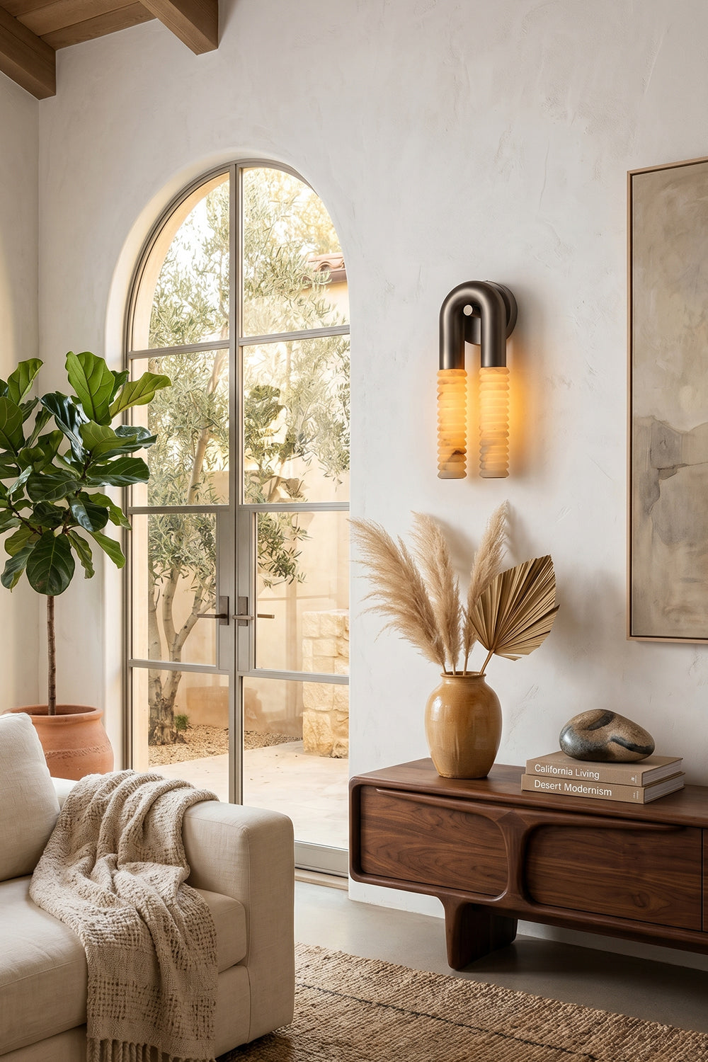 Monolith Arc Alabaster Wall Lamp | Alabaster, Metal | Mounted in a bright entrance with an arched window and rustic wooden console table | Samu Lamp