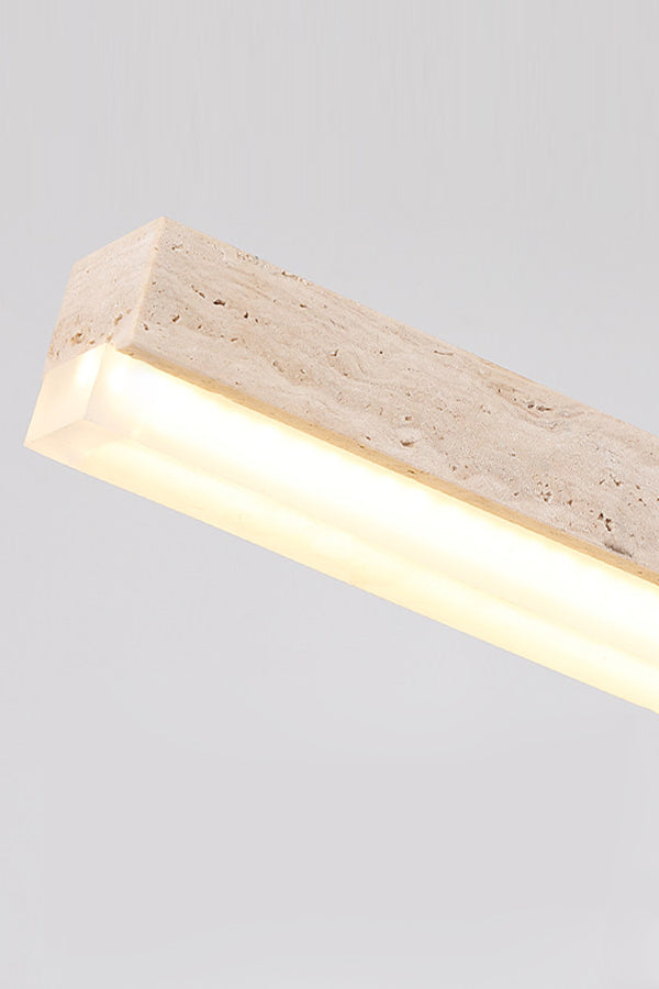Detailed side view of lit travertine linear lamp | Travertine, Acrylic | Showing the stone texture and acrylic diffuser | Samu Lamp