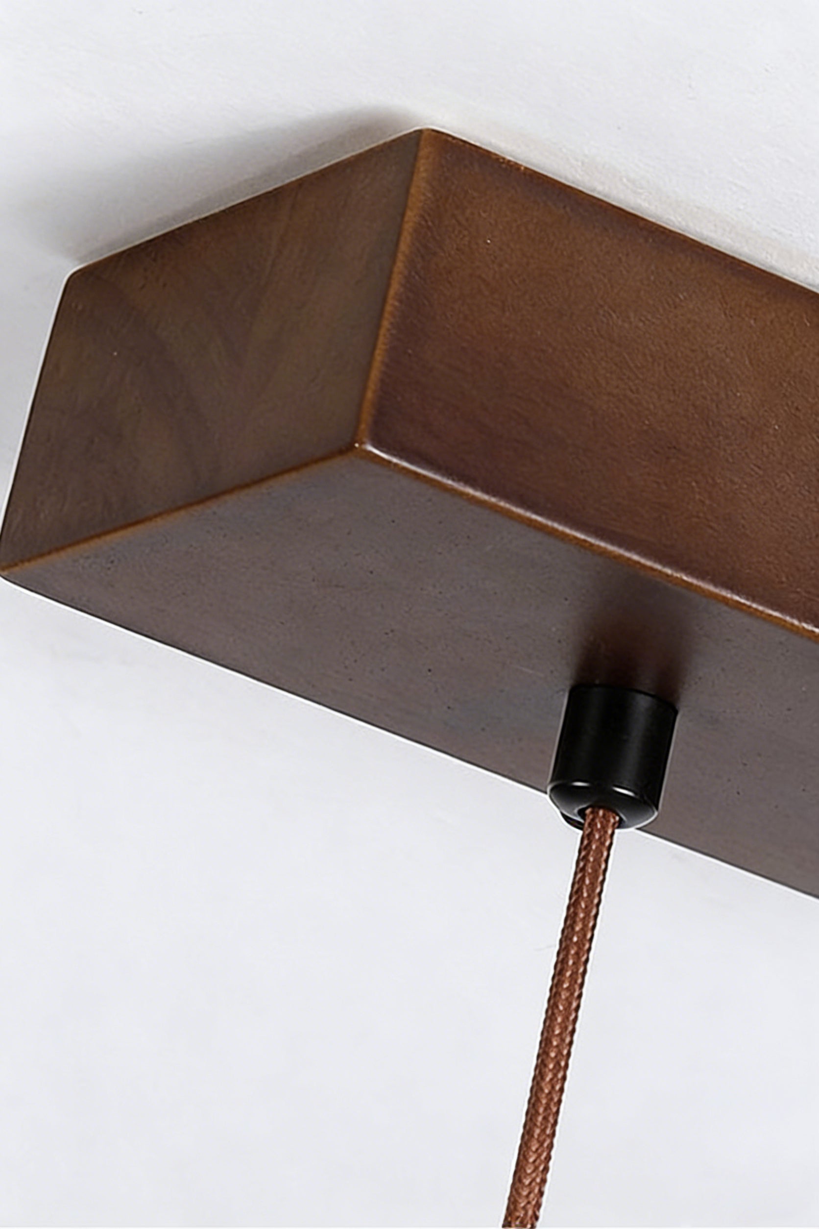 Close-up of wooden ceiling canopy and cord | Wood | Showing the dark wood finish and mounting detail | Samu Lamp