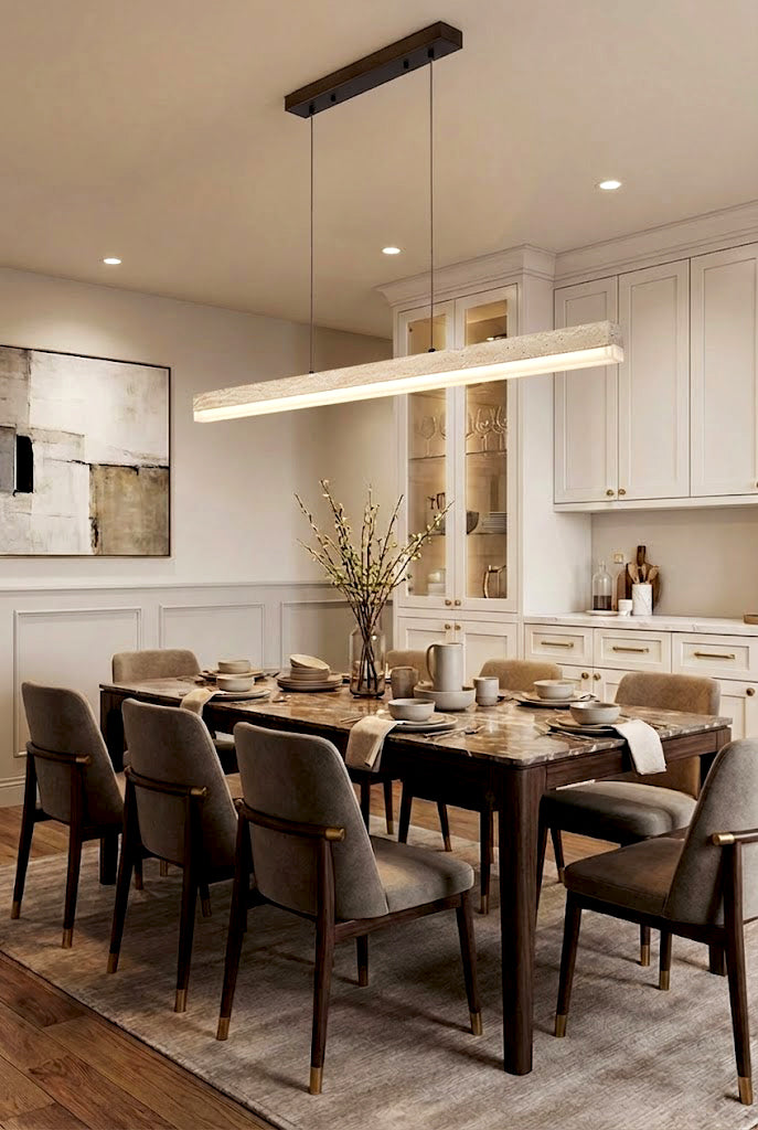 Linear travertine dining light over a long table | Travertine, Wood, Acrylic | Formal dining room interior with neutral chairs | Samu Lamp