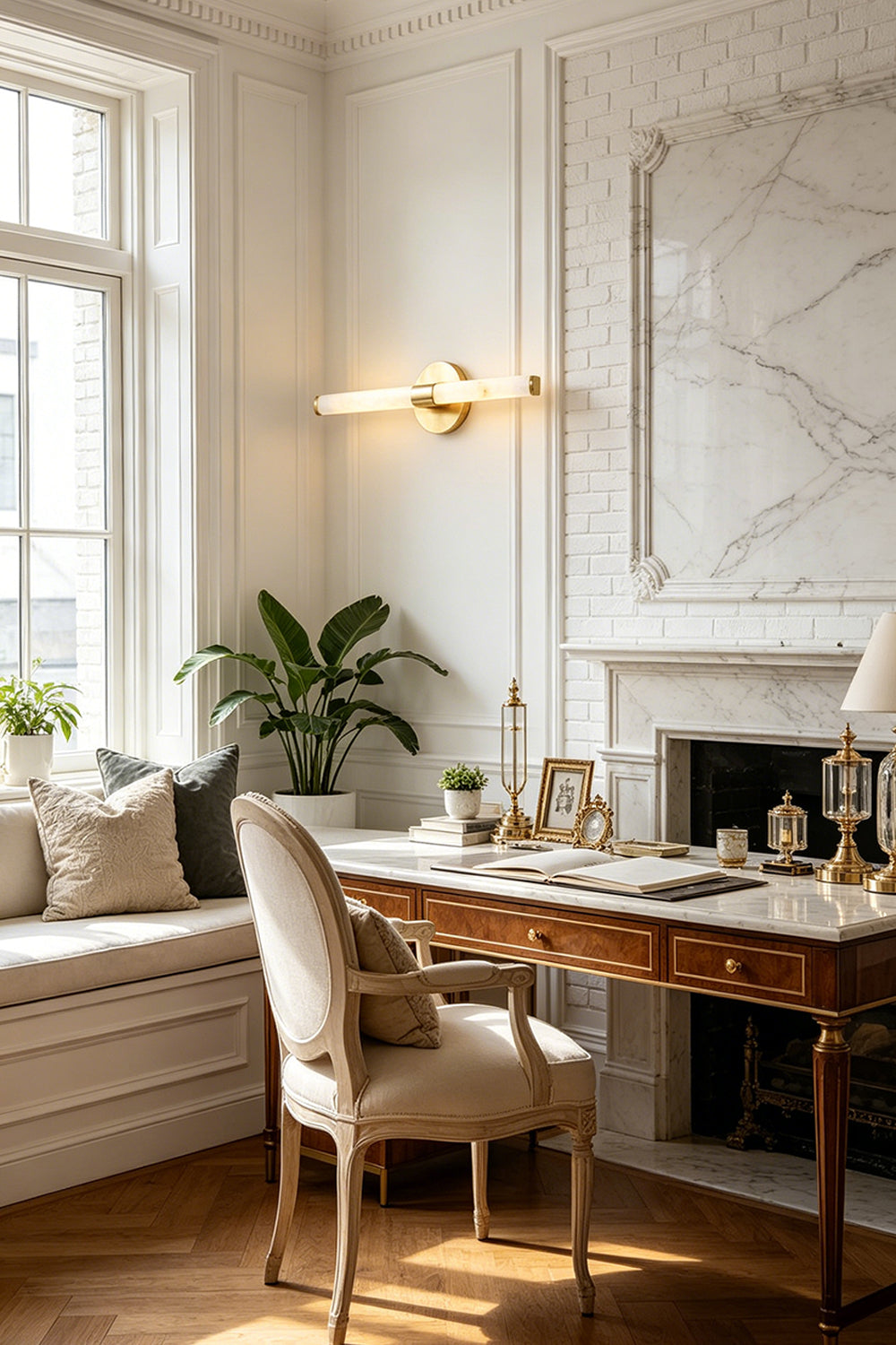 Nerida Linear Alabaster Wall Sconce | Alabaster, Brass | Providing sophisticated ambient lighting on a paneled wall in a traditional home study next to a window bench and stone fireplace | Samu Lamp