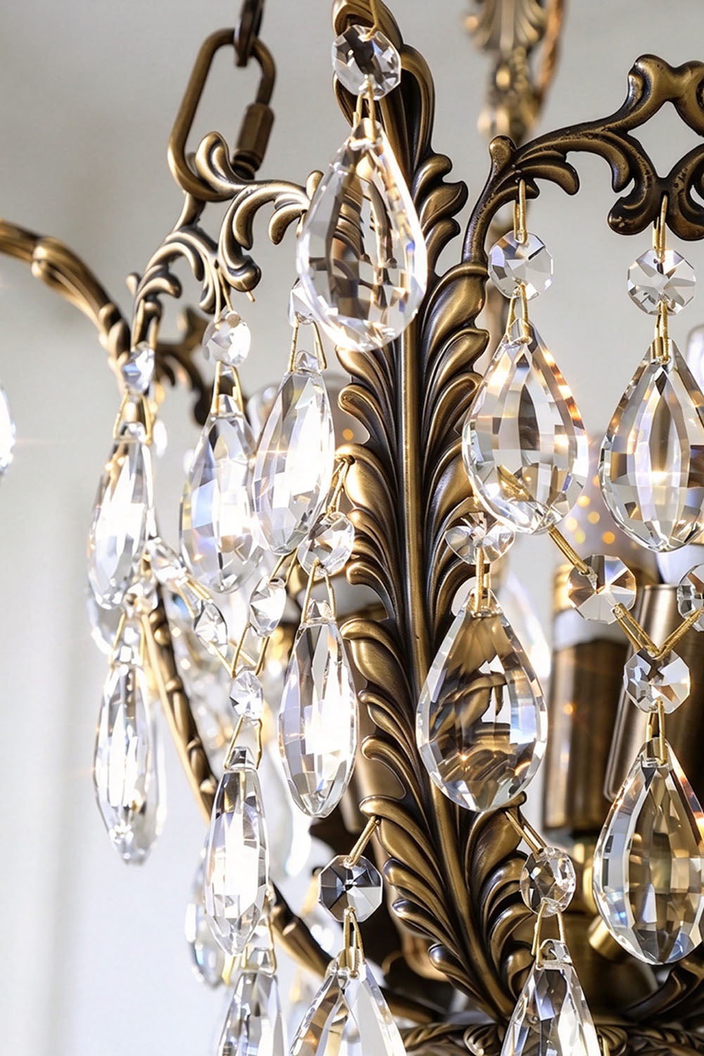 Close-up of Ninon Crystal Basket Brass Pendant Light showcasing elegant crystal drops and ornate brass details.
