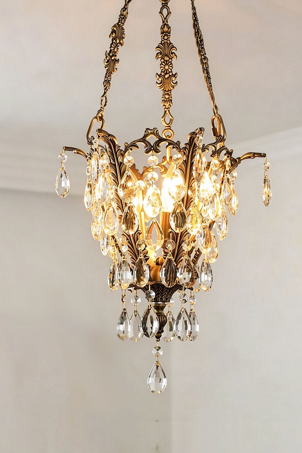 Ninon Crystal Basket Brass Pendant Light featuring elegant crystal drops and intricate brass detailing.
