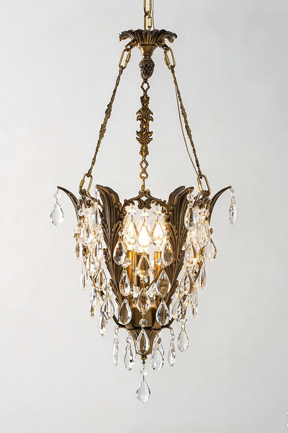 Ninon Crystal Basket Brass Pendant Light featuring elegant crystal details and ornamental design.