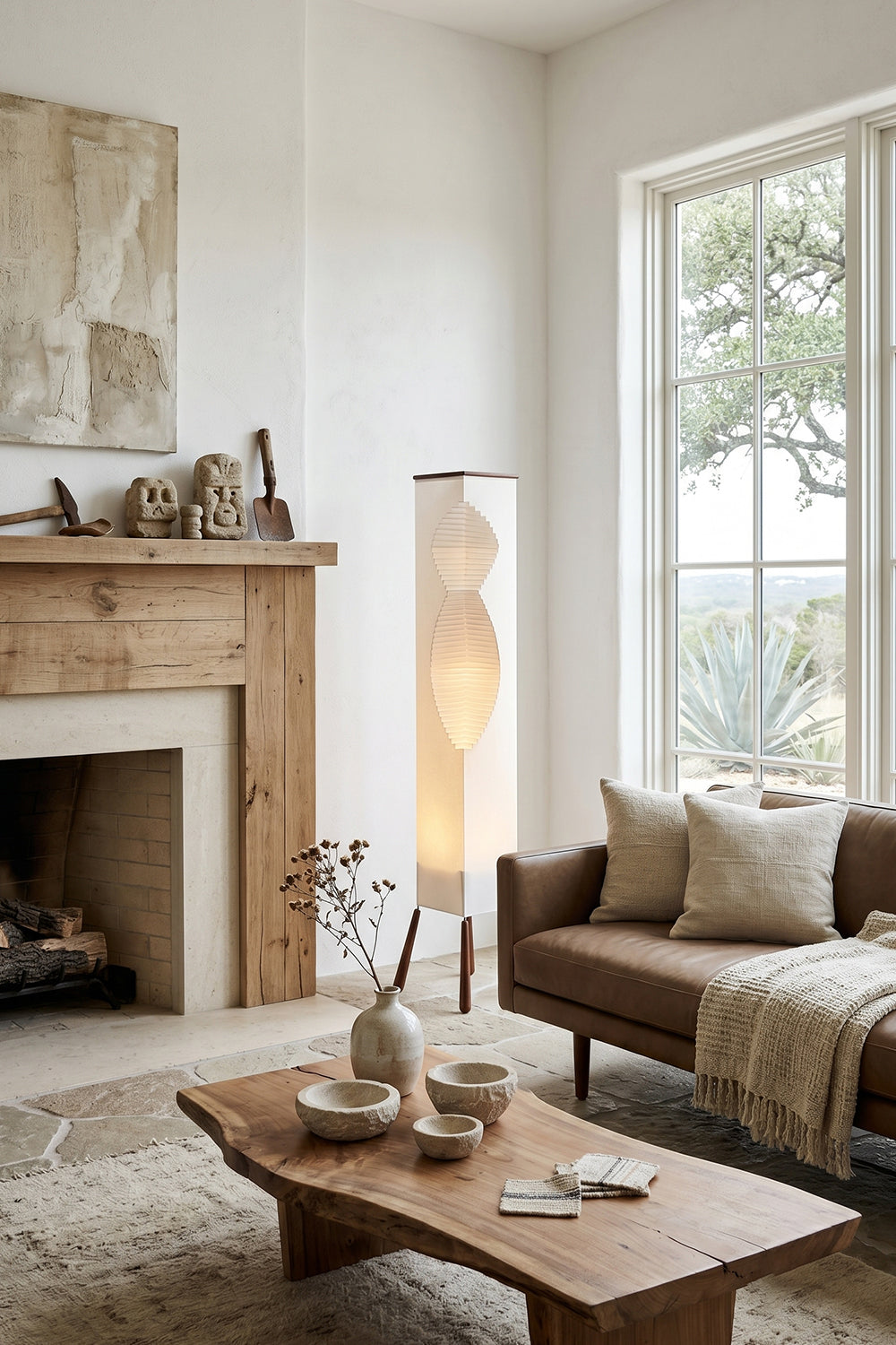 Nori Sculptural Leaf Floor Lamp | Fabric, Wood | Placed in a cozy living room corner next to a window, fireplace, and low wooden coffee table | Samu Lamp