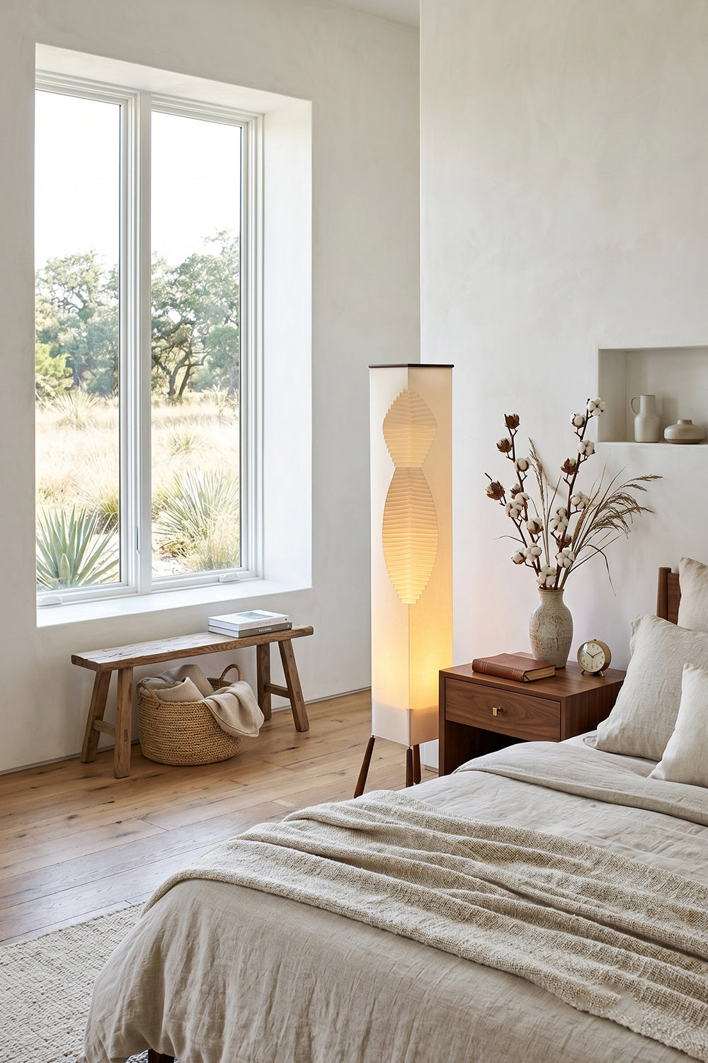 Nori Sculptural Leaf Floor Lamp | Fabric, Wood | Standing as a warm bedroom corner nightlight next to a window and cream bed linens | Samu Lamp