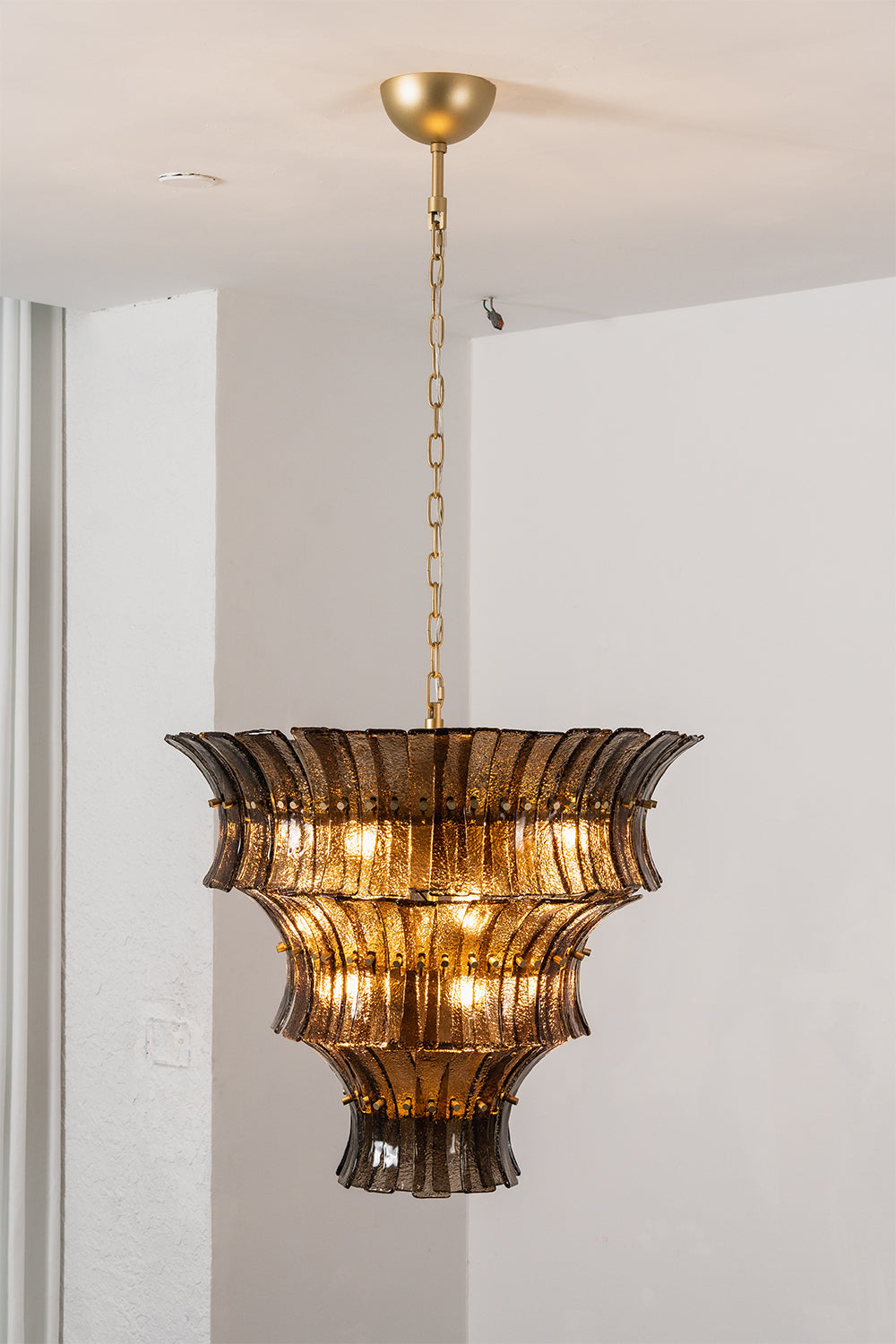 Octavia Sculptural Smoked Glass Chandelier | Studio Lit View | Full-length studio presentation of the fully illuminated tall multi-tiered conical smoked glass chandelier | Samu Lamp