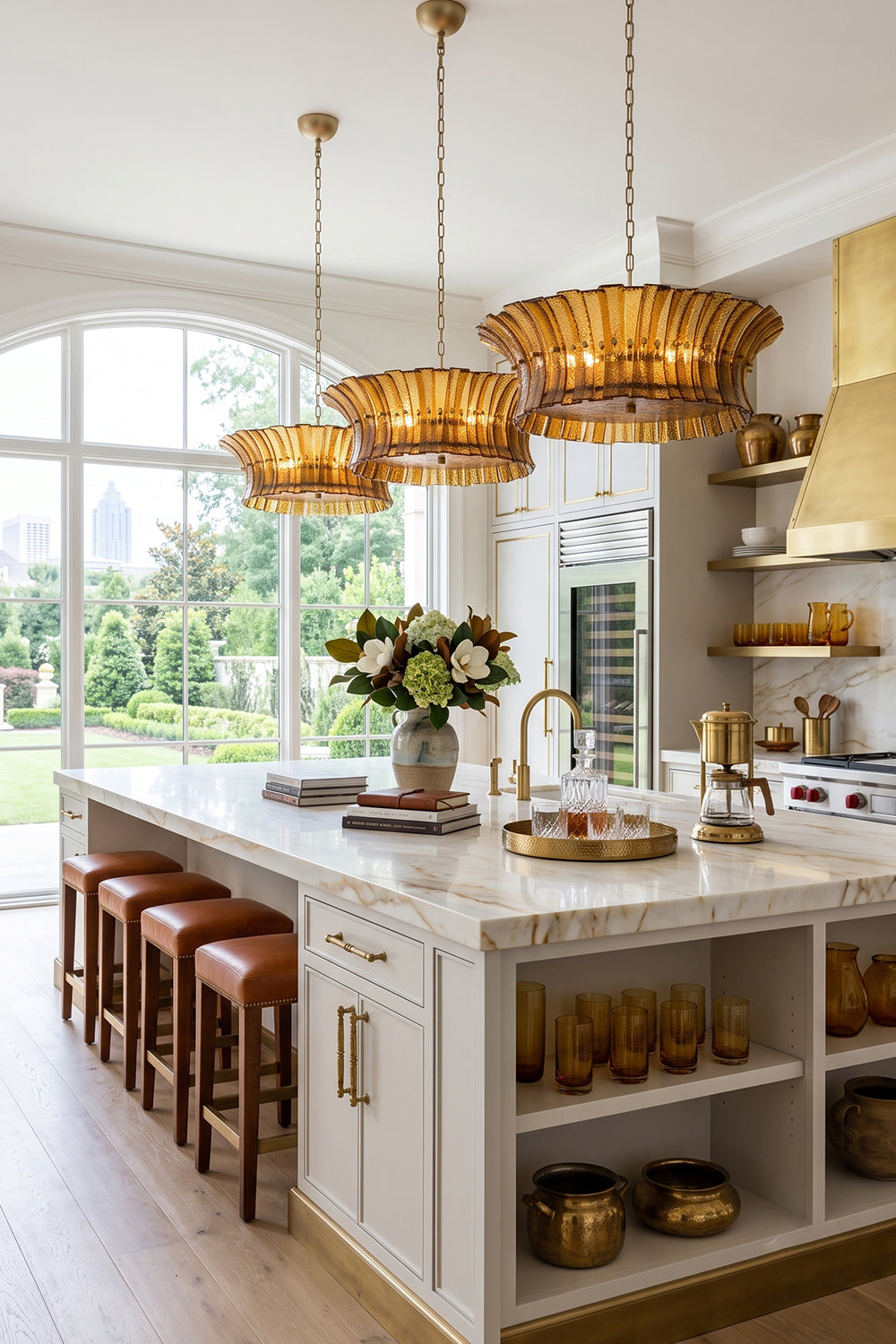 Octavia Sculptural Smoked Glass Chandelier | Modern Kitchen Lighting | Multiple elegant smoked glass chandeliers suspended over a pristine white marble waterfall island with tan barstools | Samu Lamp