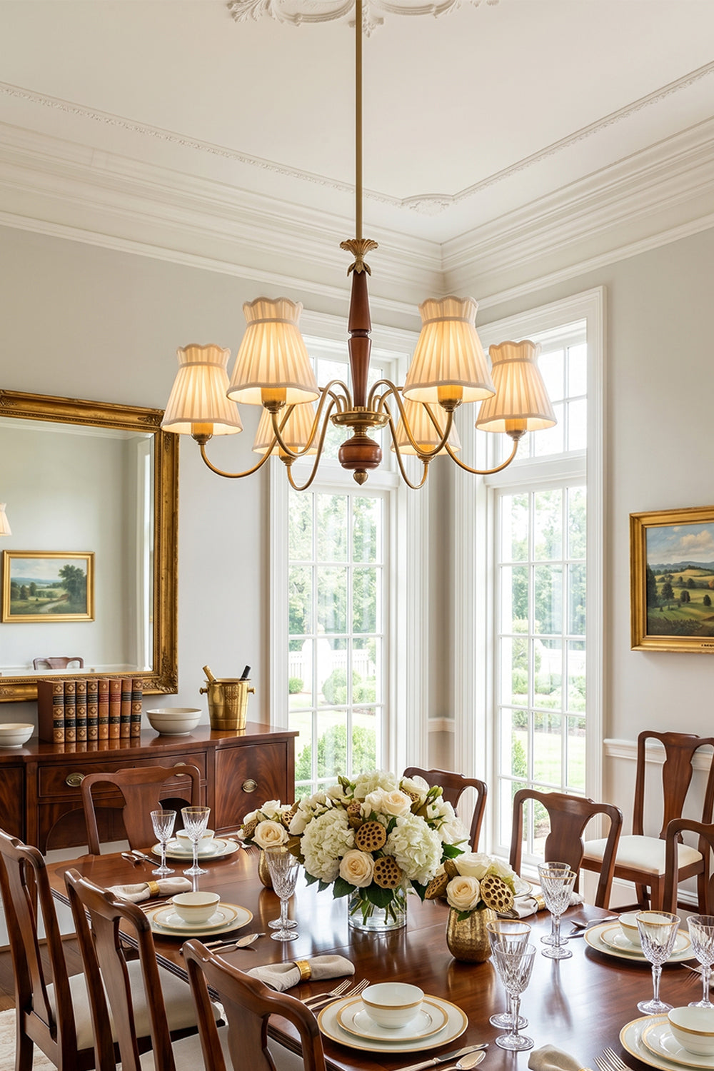 Odette Vintage Pleated Shaded Chandelier | Wood, Brass, Fabric | Illuminating a grand formal dining room setup, casting a warm cozy glow over a long wooden dining table and upholstered chairs | Samu Lamp