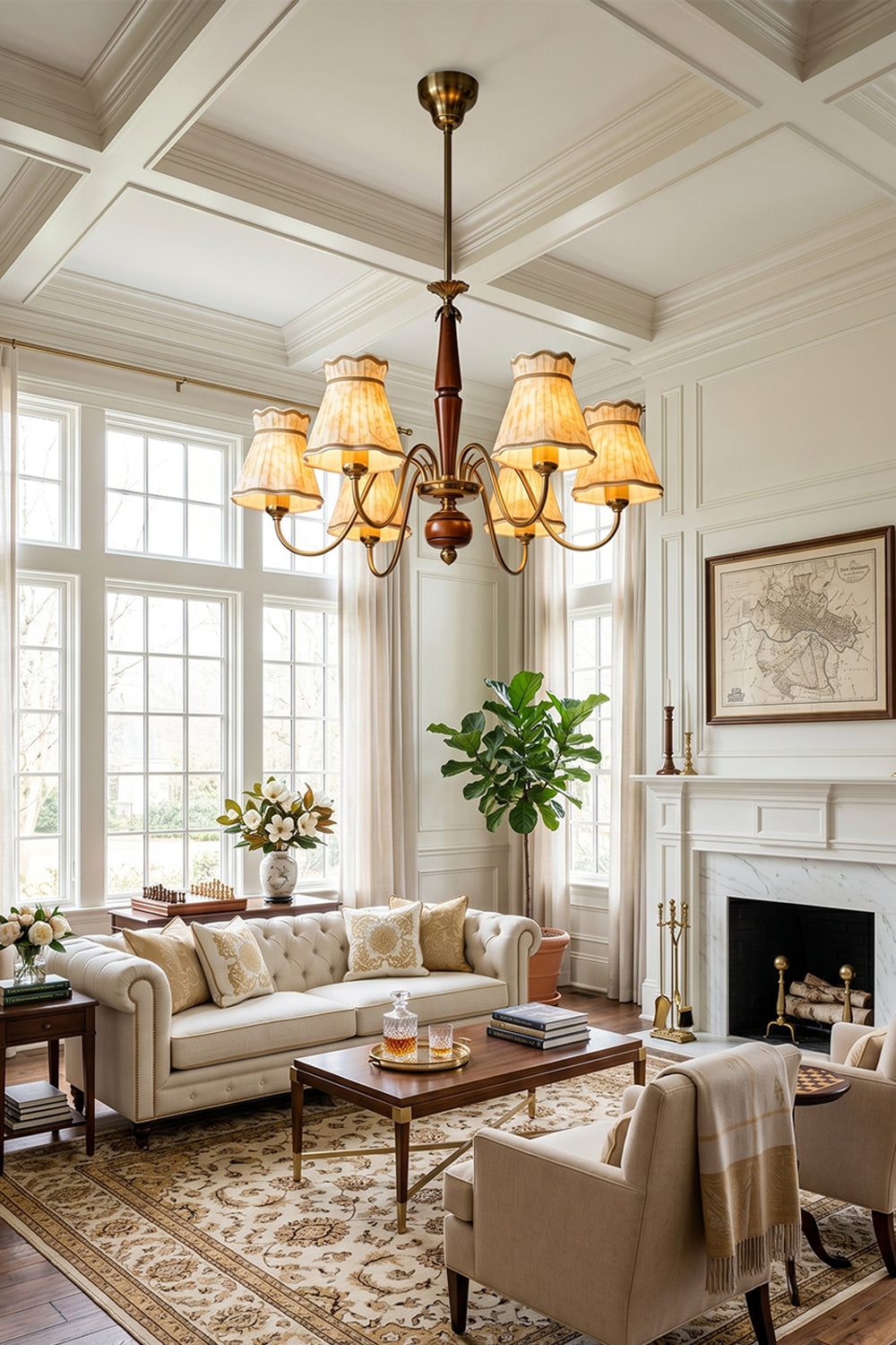 Odette Vintage Pleated Shaded Chandelier | Wood, Brass, Fabric | Wide-angle room view of the illuminated vintage shaded fixture hanging from a high paneled ceiling in a spacious luxury traditional lounge room | Samu Lamp