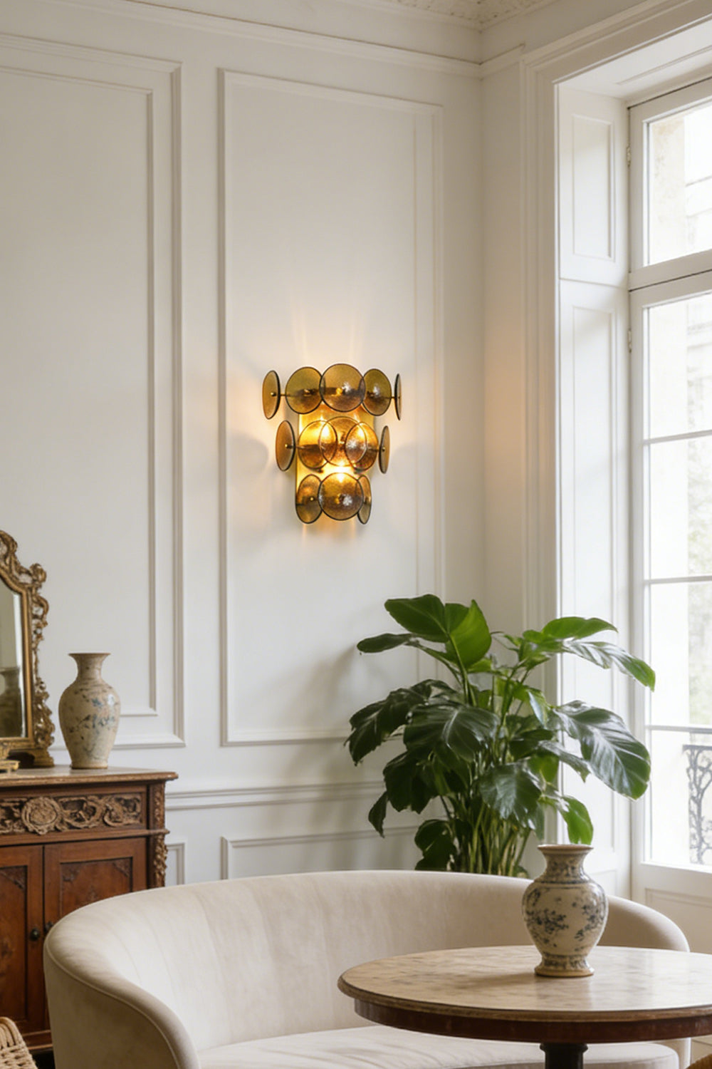 Lit olive green hammered glass wall light | Metal, Glass | Installed in a traditional living room by a window | Samu Lamp